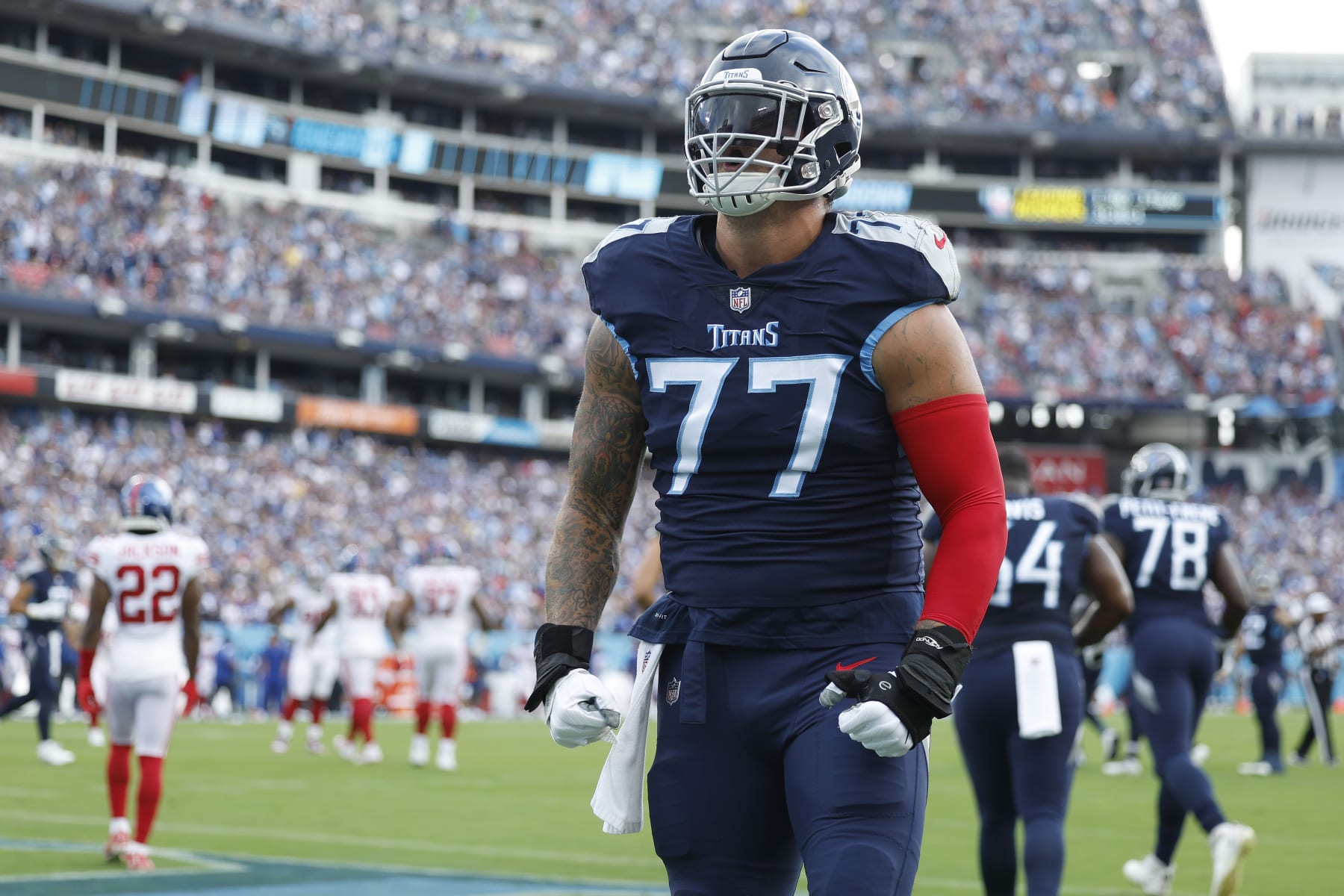 NASHVILLE, TENNESSEE - SEPTEMBER 11: Offensive tackle Taylor Lewan #77 of the Tennessee Titans yells towards fans after a touchdown during the first quarter against the New York Giants at Nissan Stadium on September 11, 2022 in Nashville, Tennessee. (Photo by Wesley Hitt/Getty Images)