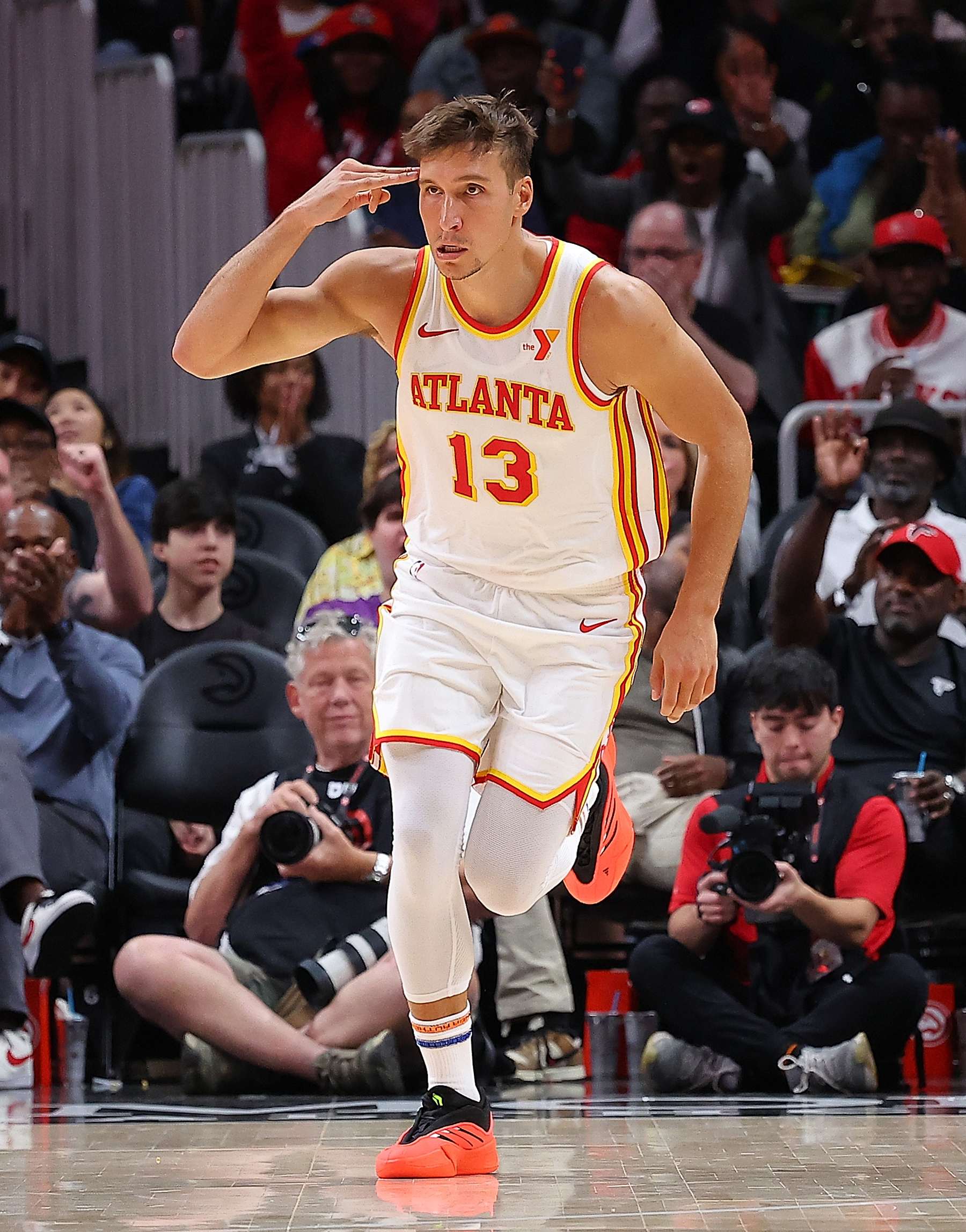 ATLANTA, GEORGIA - OCTOBER 14:  Bogdan Bogdanovic #13 of the Atlanta Hawks reacts after a three-point basket against the Philadelphia 76ers during the second quarter at State Farm Arena on October 14, 2024 in Atlanta, Georgia.  NOTE TO USER: User expressly acknowledges and agrees that, by downloading and/or using this photograph, user is consenting to the terms and conditions of the Getty Images License Agreement.  (Photo by Kevin C. Cox/Getty Images)