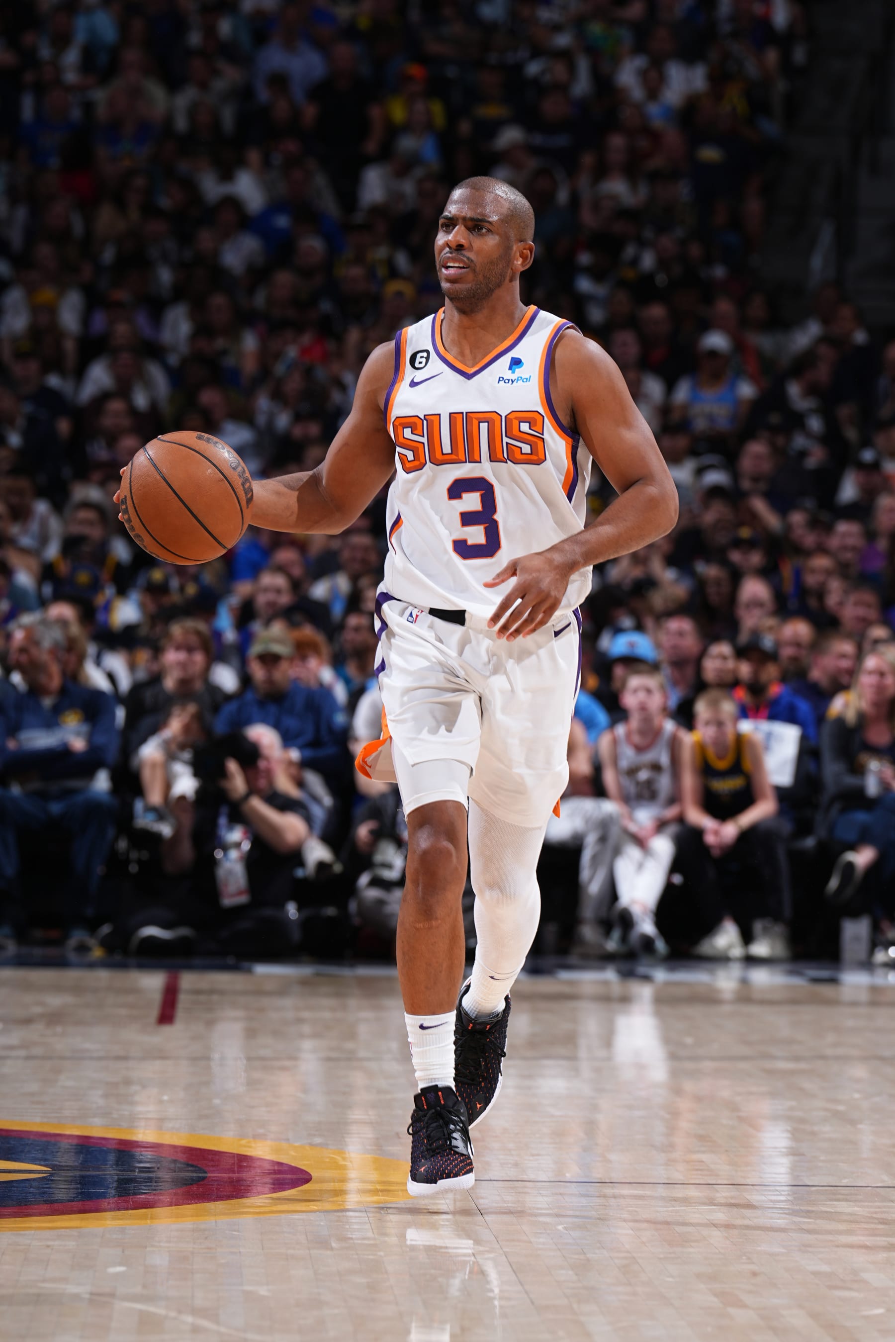 DENVER, CO - MAY 1: Chris Paul #3 of the Phoenix Suns dribbles the ball during Game Two of the Western Conference Semi-Finals of the 2023 NBA Playoffs against the Denver Nuggets on May 1, 2023 at the Ball Arena in Denver, Colorado. NOTE TO USER: User expressly acknowledges and agrees that, by downloading and/or using this Photograph, user is consenting to the terms and conditions of the Getty Images License Agreement. Mandatory Copyright Notice: Copyright 2023 NBAE (Photo by Garrett Ellwood/NBAE via Getty Images)