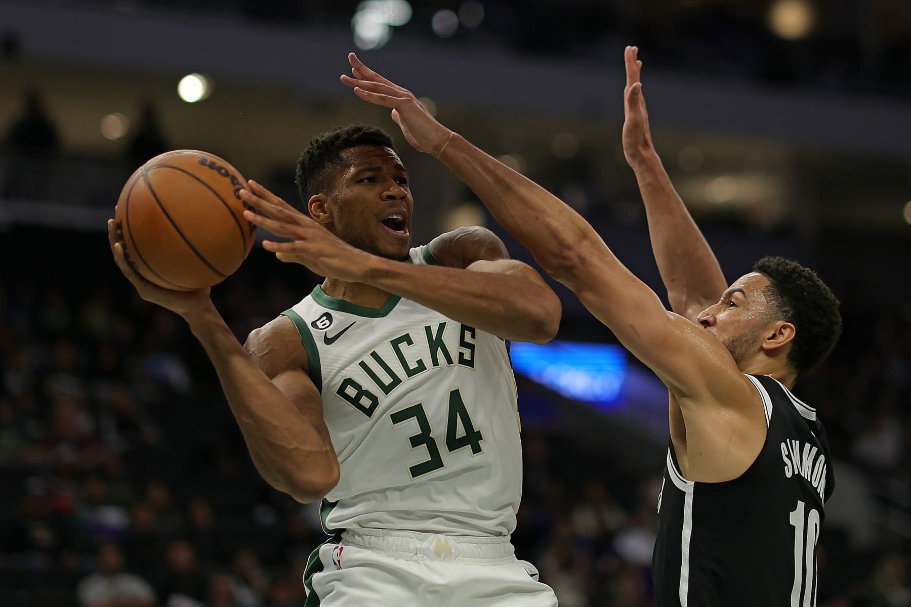 MILWAUKEE, WISCONSIN - OCTOBER 12: Giannis Antetokounmpo #34 of the Milwaukee Bucks is defended by Ben Simmons #10 of the Brooklyn Nets during the first half of a preseason game at Fiserv Forum on October 12, 2022 in Milwaukee, Wisconsin. NOTE TO USER: User expressly acknowledges and agrees that, by downloading and or using this photograph, User is consenting to the terms and conditions of the Getty Images License Agreement. (Photo by Stacy Revere/Getty Images)