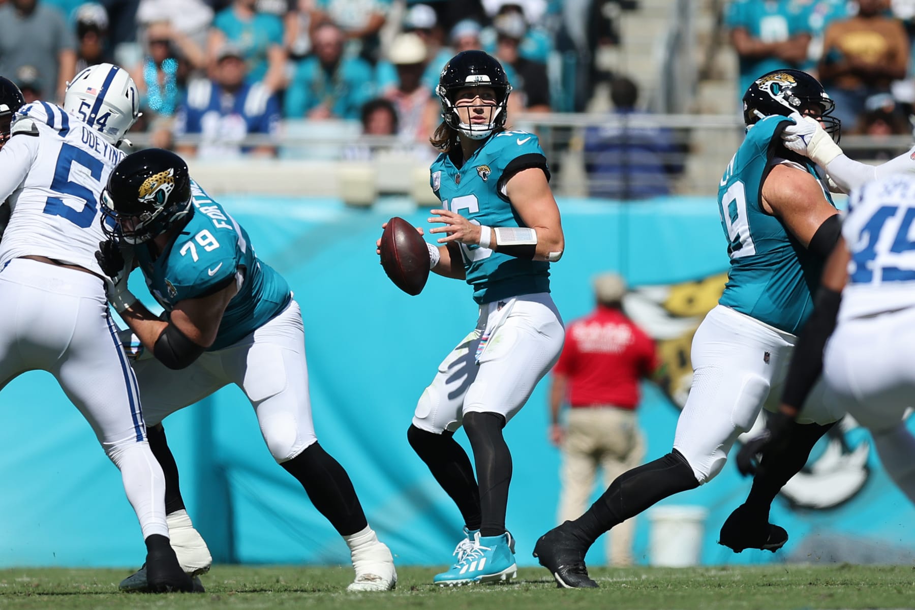 JACKSONVILLE, FLORIDA - OCTOBER 15: Trevor Lawrence #16 of the Jacksonville Jaguars looks to pass during the second quarter against the Indianapolis Colts at EverBank Stadium on October 15, 2023 in Jacksonville, Florida. (Photo by Mike Carlson/Getty Images)