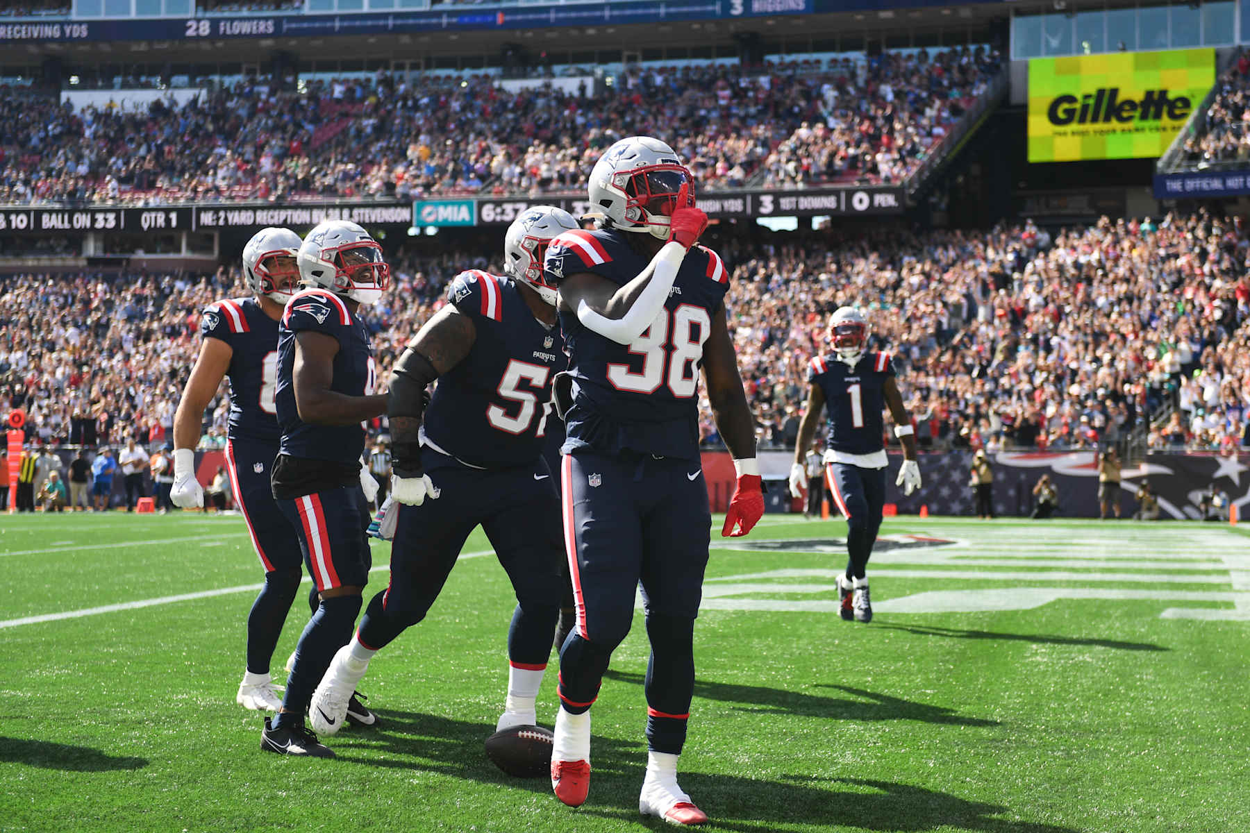 FOXBOROUGH, MASSACHUSETTS - OCTOBER 6: Rhamondre Stevenson #38 of the New England Patriots reacts after scoring a touchdown during the first quarter against the Miami Dolphins at Gillette Stadium on October 6, 2024 in Foxborough, Massachusetts. (Photo by Kathryn Riley/Getty Images)