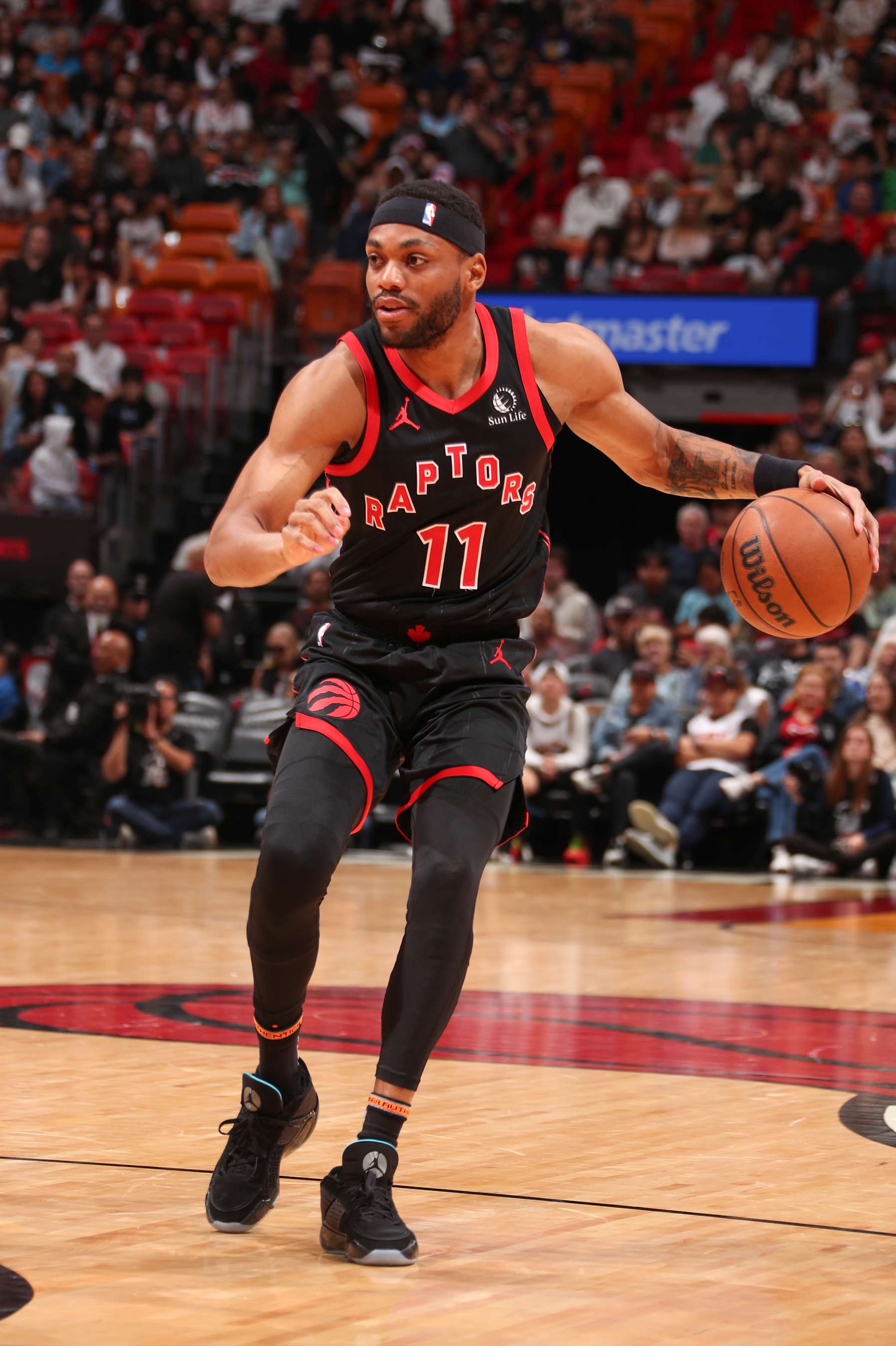 MIAMI, FL - APRIL 14:  Bruce Brown #11 of the Toronto Raptors handles the ball during the game  on April 14, 2024 at Kaseya Center in Miami, Florida. NOTE TO USER: User expressly acknowledges and agrees that, by downloading and or using this Photograph, user is consenting to the terms and conditions of the Getty Images License Agreement. Mandatory Copyright Notice: Copyright 2024 NBAE (Photo by Issac Baldizon/NBAE via Getty Images)