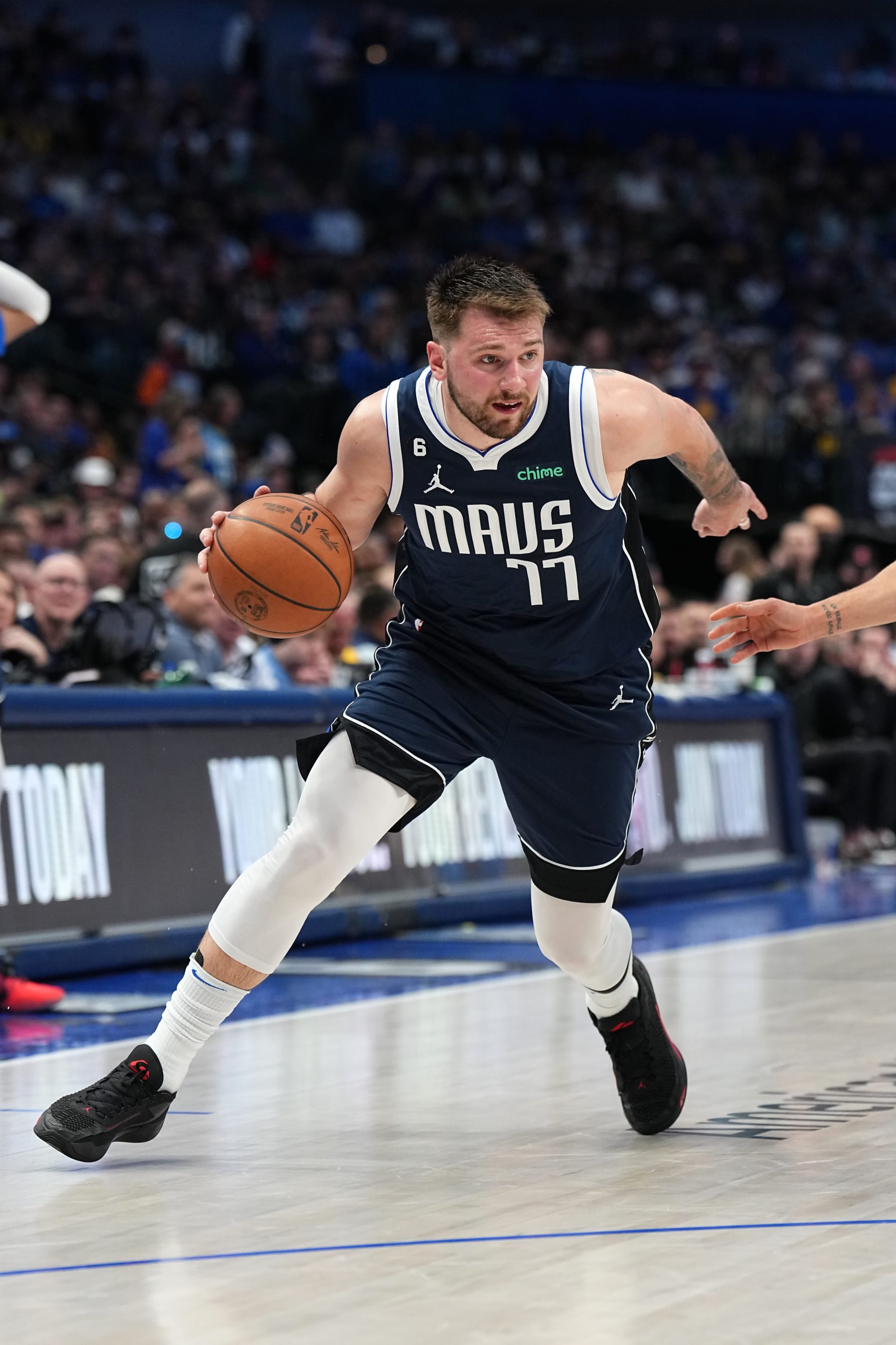 DALLAS, TX - MARCH 22: Luka Doncic #77 of the Dallas Mavericks moves the ball during the game against the Golden State Warriors on March 22, 2023 at the American Airlines Center in Dallas, Texas. NOTE TO USER: User expressly acknowledges and agrees that, by downloading and or using this photograph, User is consenting to the terms and conditions of the Getty Images License Agreement. Mandatory Copyright Notice: Copyright 2023 NBAE (Photo by Glenn James/NBAE via Getty Images)