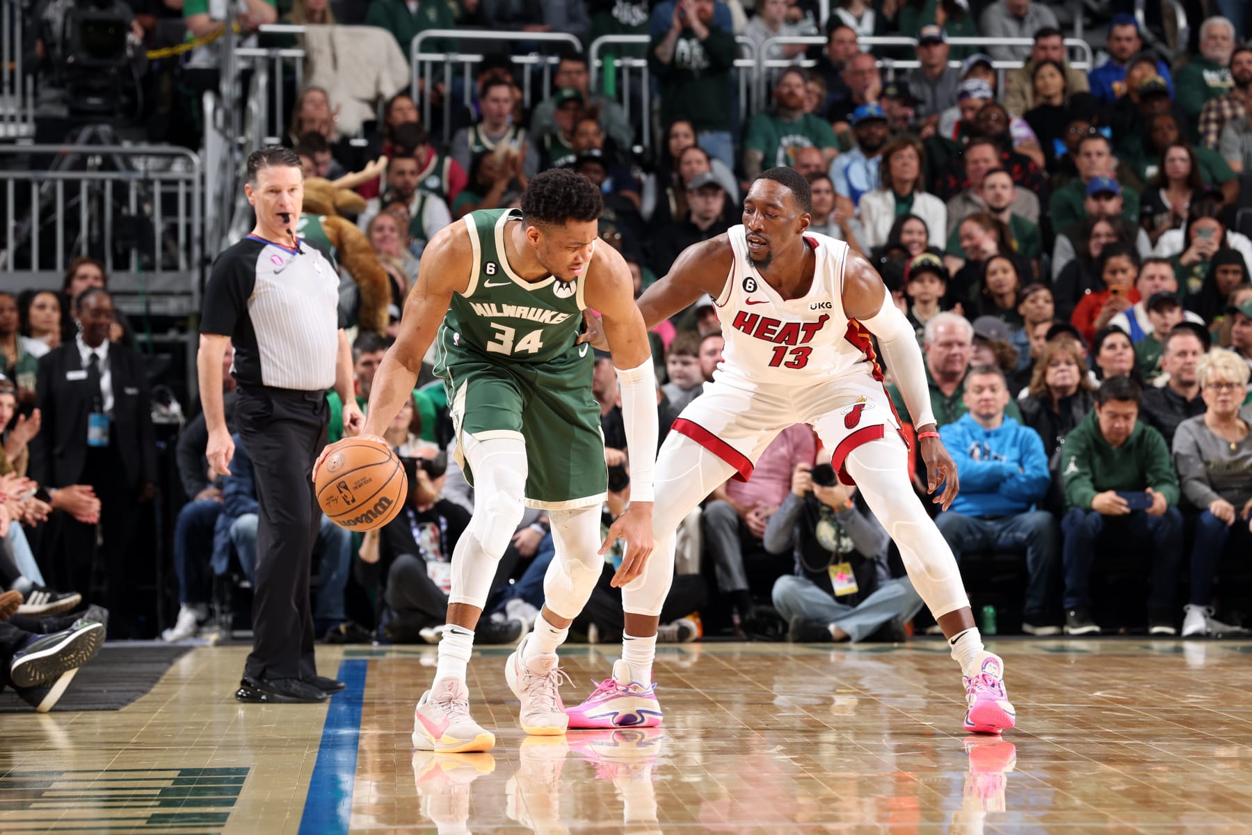 MILWAUKEE, WI - APRIL 26: Giannis Antetokounmpo #34 of the Milwaukee Bucks dribbles the ball against Bam Adebayo #13 of the Miami Heat during Round 1 Game 5 of the 2023 NBA Playoffs on April 26, 2023 at the Fiserv Forum Center in Milwaukee, Wisconsin. NOTE TO USER: User expressly acknowledges and agrees that, by downloading and or using this Photograph, user is consenting to the terms and conditions of the Getty Images License Agreement. Mandatory Copyright Notice: Copyright 2023 NBAE (Photo by Jeff Haynes/NBAE via Getty Images).