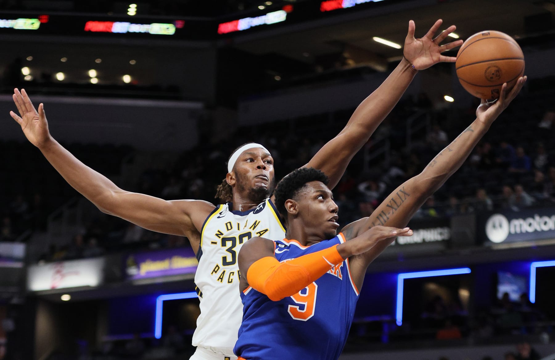 INDIANAPOLIS, INDIANA - OCTOBER 12: RJ Barrett #9 of the New York Knicks shoots the ball against while defended by Myles Turner #33 of the Indiana Pacers at Gainbridge Fieldhouse on October 12, 2022 in Indianapolis, Indiana.    NOTE TO USER: User expressly acknowledges and agrees that, by downloading and/or using this photograph, User is consenting to the terms and conditions of the Getty Images License Agreement. (Photo by Andy Lyons/Getty Images) (Photo by Andy Lyons/Getty Images)