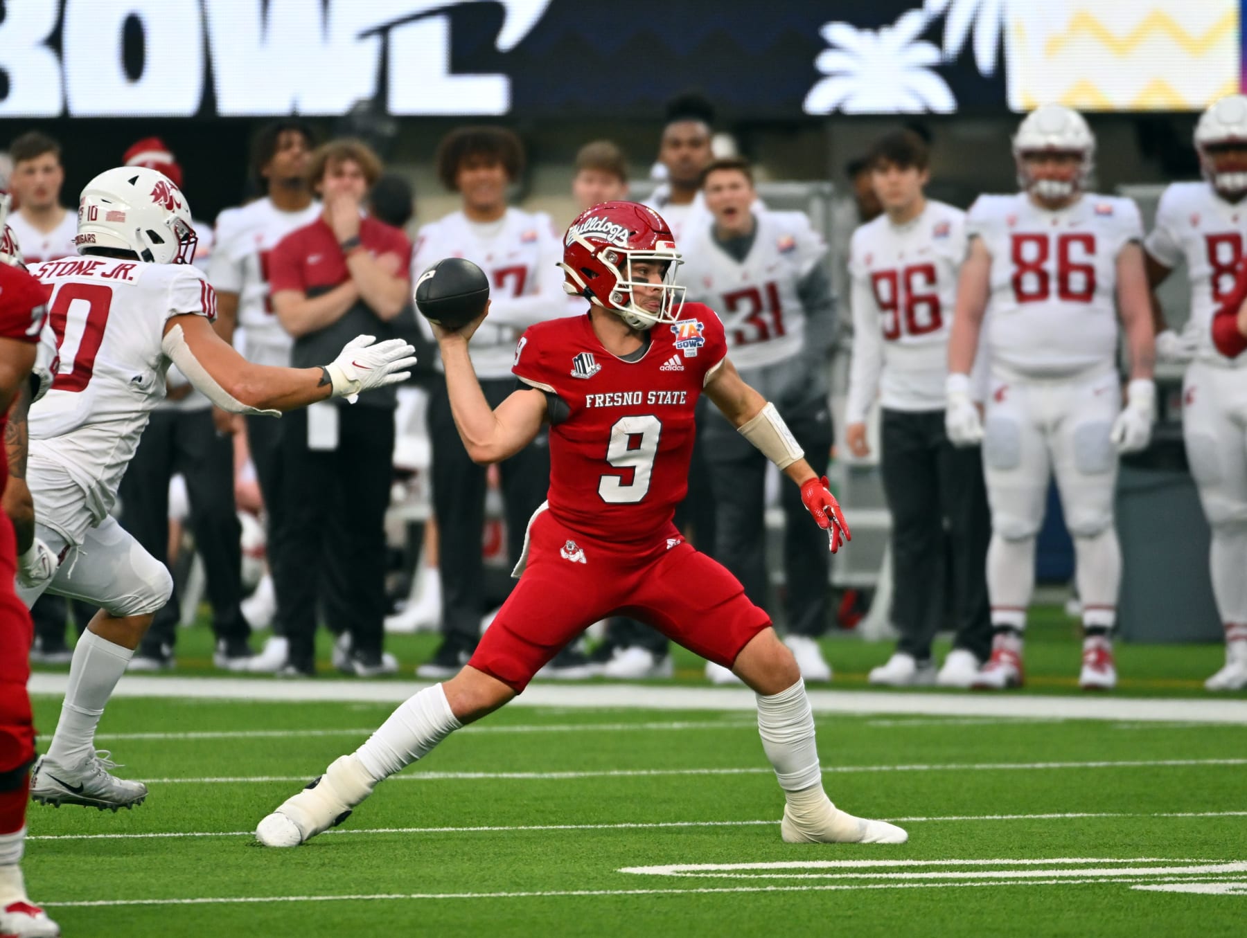 INGLEWOOD, CA - DECEMBER 17: Quarterback Jake Haener #9 of the Fresno State Bulldogs throws a pass against the Washington State Cougars during the first half of the Jimmy Kimmel LA Bowl Presented by Stifel at SoFi Stadium on December 17, 2022 in Inglewood, California. (Photo by Kevork Djansezian/Getty Images)