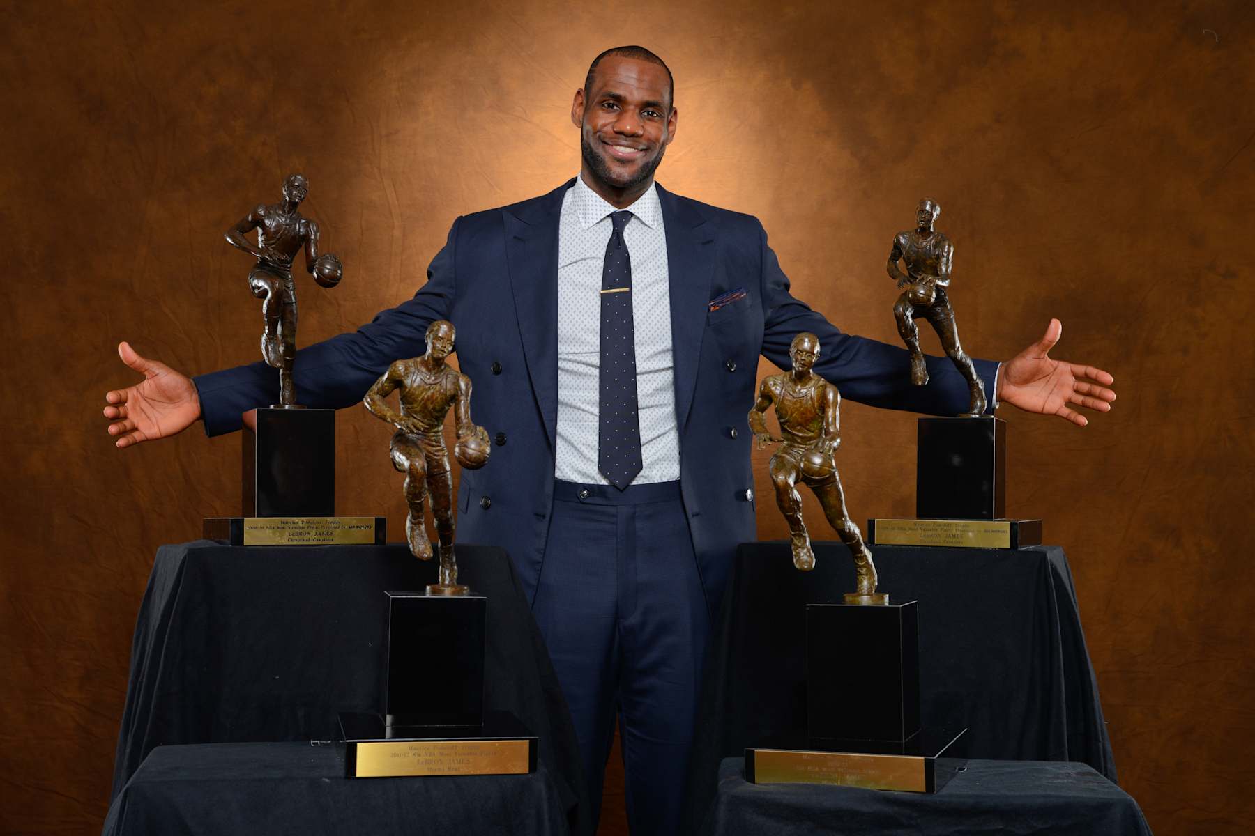 MIAMI, FL - MAY 5: LeBron James #6 of the Miami Heat poses with his collection of Maurice Podoloff Trophies after being named the 2012-2013 Kia NBA Most Valuable Player (MVP) of the Year for the fourth time on May 5, 2013 at American Airlines Arena in Miami, Florida. NOTE TO USER: User expressly acknowledges and agrees that, by downloading and or using this photograph, User is consenting to the terms and conditions of the Getty Images License Agreement. Mandatory Copyright Notice: Copyright 2013 NBAE (Photo by Jesse D. Garrabrant/NBAE via Getty Images)
