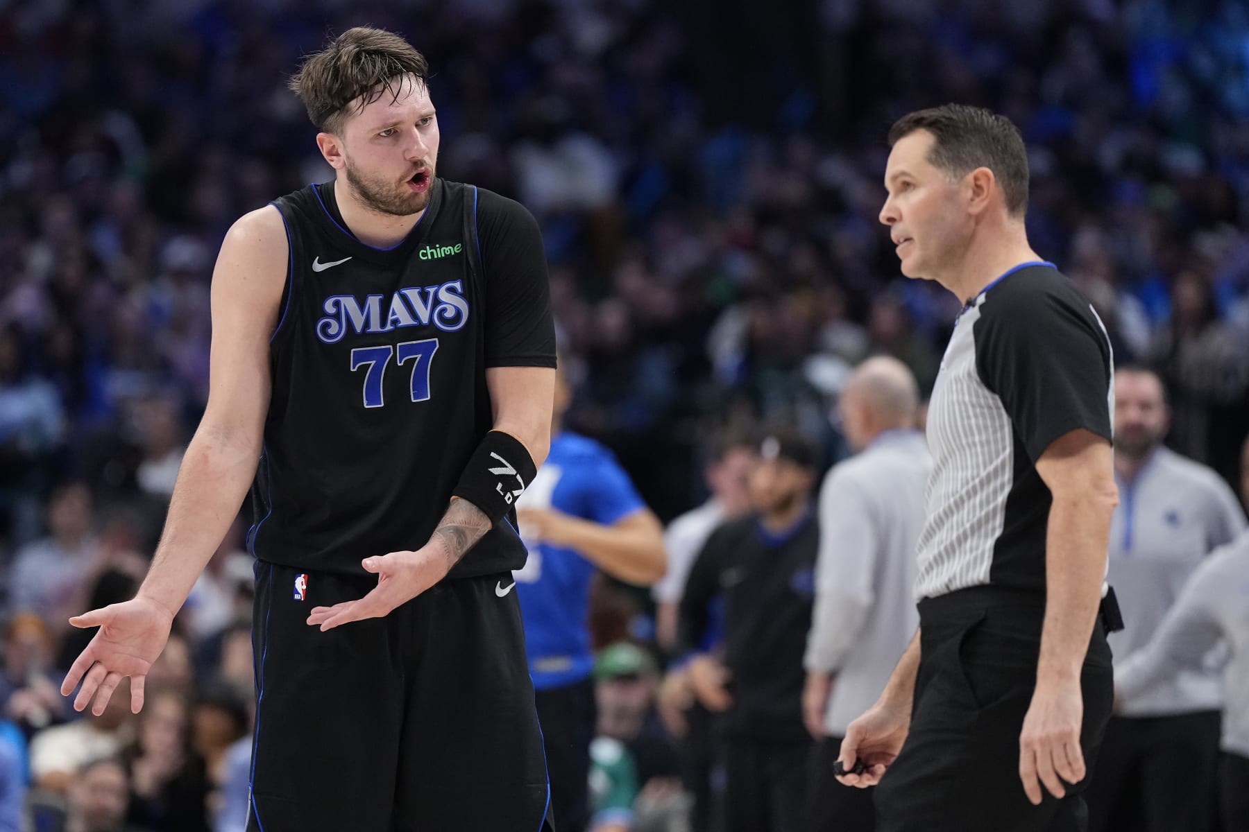 DALLAS, TEXAS - FEBRUARY 03: Luka Doncic #77 of the Dallas Mavericks reacts during the first half against the Milwaukee Bucks at American Airlines Center on February 03, 2024 in Dallas, Texas. NOTE TO USER: User expressly acknowledges and agrees that, by downloading and or using this photograph, User is consenting to the terms and conditions of the Getty Images License Agreement. (Photo by Sam Hodde/Getty Images)