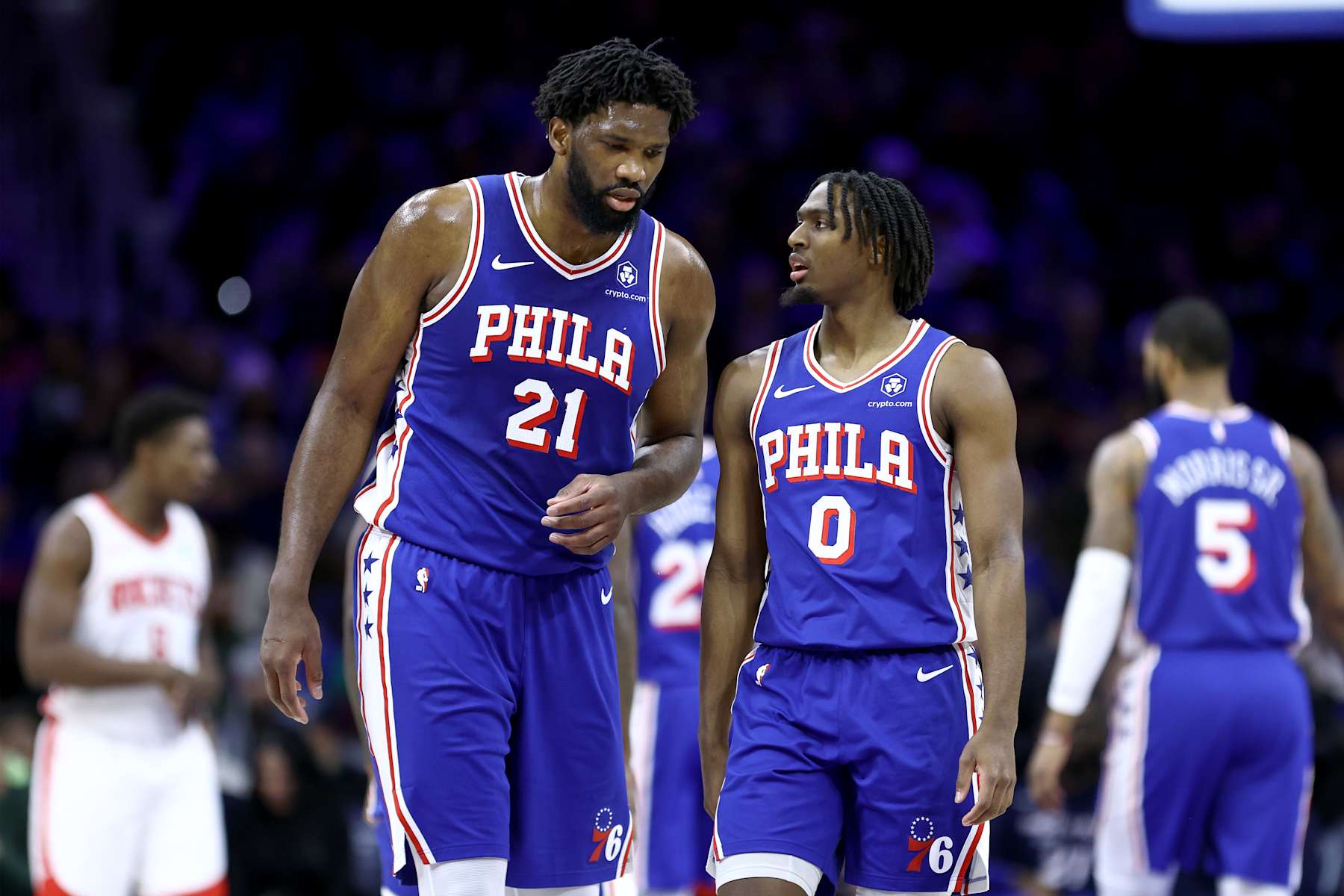 PHILADELPHIA, PENNSYLVANIA - JANUARY 15: Joel Embiid #21 and Tyrese Maxey #0 of the Philadelphia 76ers speak during the first quarter against the Houston Rockets at the Wells Fargo Center on January 15, 2024 in Philadelphia, Pennsylvania. NOTE TO USER: User expressly acknowledges and agrees that, by downloading and or using this photograph, User is consenting to the terms and conditions of the Getty Images License Agreement. (Photo by Tim Nwachukwu/Getty Images)