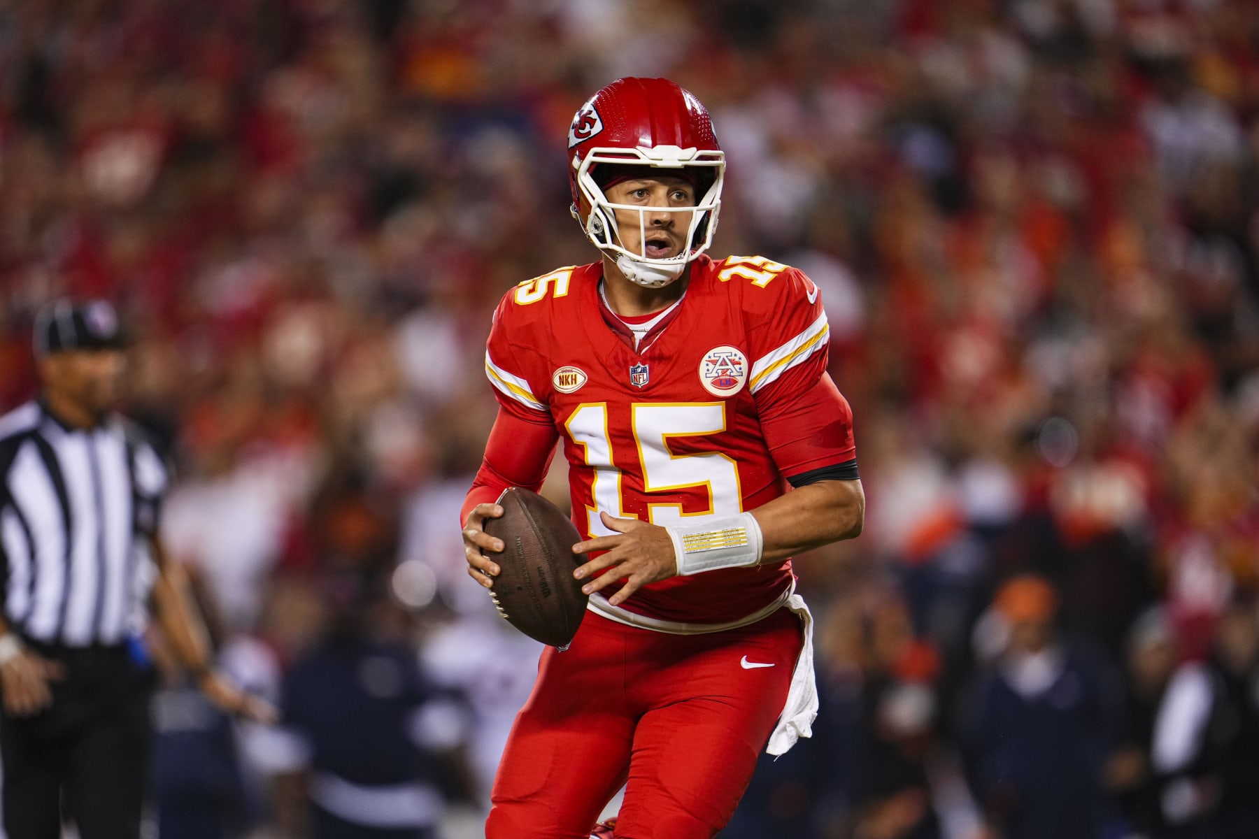 KANSAS CITY, MO - OCTOBER 12: Patrick Mahomes #15 of the Kansas City Chiefs scrambles out of the pocket during an NFL football game against the Denver Broncos at GEHA Field at Arrowhead Stadium on October 12, 2023 in Kansas City, Missouri. (Photo by Cooper Neill/Getty Images)