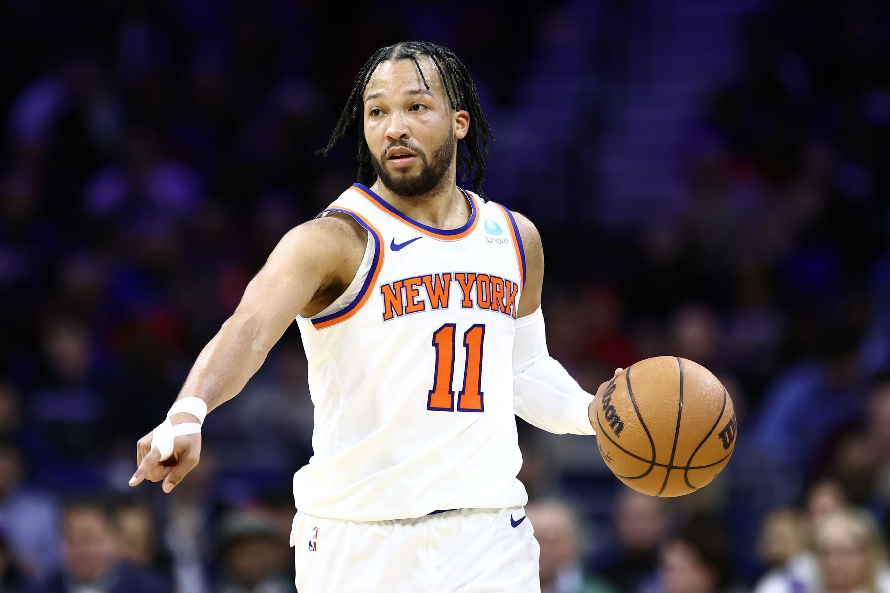 PHILADELPHIA, PENNSYLVANIA - FEBRUARY 22: Jalen Brunson #11 of the New York Knicks dribbles during the third quarter against the Philadelphia 76ers at the Wells Fargo Center on February 22, 2024 in Philadelphia, Pennsylvania. (Photo by Tim Nwachukwu/Getty Images)