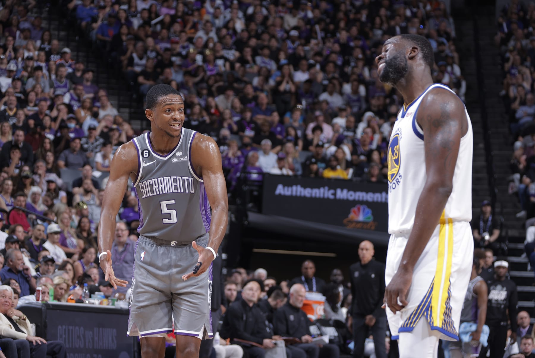 SACRAMENTO, CA - APRIL 26: De'Aaron Fox #5 of the Sacramento Kings and Draymond Green #23 of the Golden State Warriors talk during Round 1 Game 5 of the 2023 NBA Playoffs on April 26, 2023 at Golden 1 Center in Sacramento, California. NOTE TO USER: User expressly acknowledges and agrees that, by downloading and or using this photograph, User is consenting to the terms and conditions of the Getty Images Agreement. Mandatory Copyright Notice: Copyright 2023 NBAE (Photo by Rocky Widner/NBAE via Getty Images)
