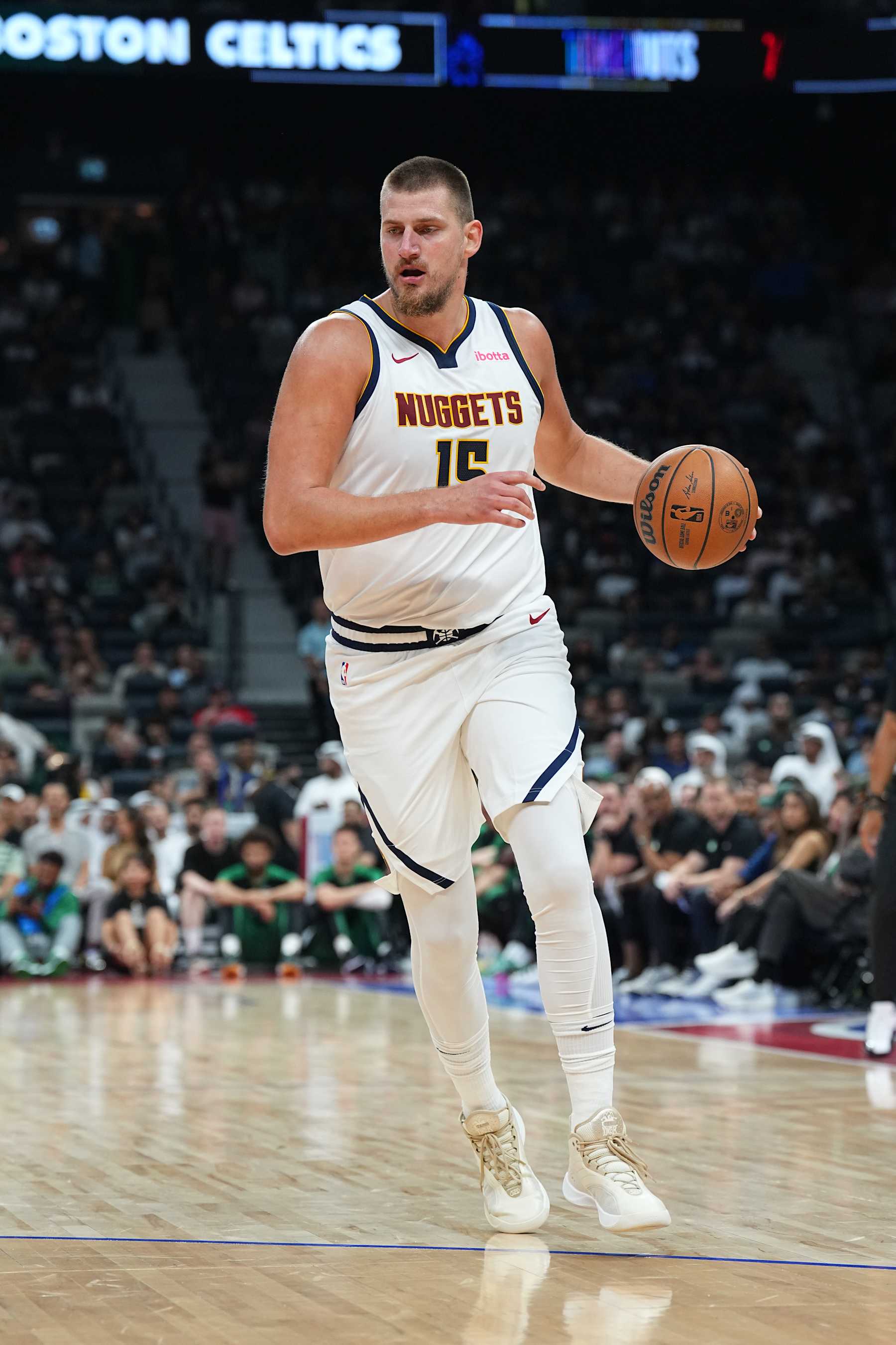 ABU DHABI, UAE - OCTOBER 4: Nikola Jokic #15 of the Denver Nuggets dribbles the ball during the game against the Boston Celtics during the 2024 Global Games on October 4, 2024 at the Etihad Arena in Abu Dhabi, United Arab Emirates. NOTE TO USER: User expressly acknowledges and agrees that, by downloading and/or using this Photograph, user is consenting to the terms and conditions of the Getty Images License Agreement. Mandatory Copyright Notice: Copyright 2024 NBAE (Photo by Garrett Ellwood/NBAE via Getty Images)