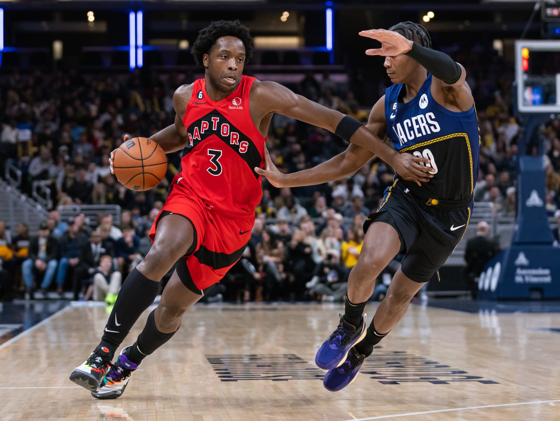INDIANAPOLIS, IN - NOVEMBER 12: O.G. Anunoby #3 of the Toronto Raptors dribbles against Bennedict Mathurin #00 of the Indiana Pacers at Gainbridge Fieldhouse on November 12, 2022 in Indianapolis, Indiana. NOTE TO USER: User expressly acknowledges and agrees that, by downloading and or using this photograph, User is consenting to the terms and conditions of the Getty Images License Agreement.  (Photo by Michael Hickey/Getty Images)