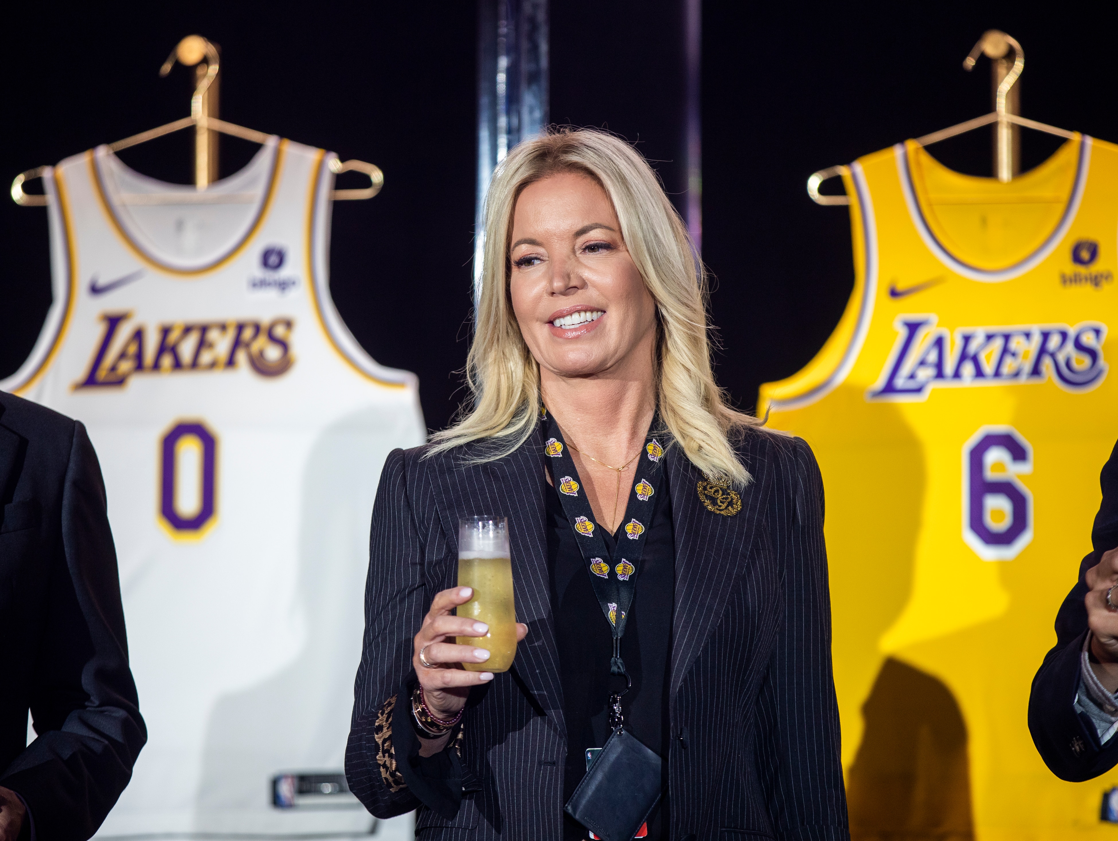 EL SEGUNDO, CA - September 20: Jeanie Buss, CEO / Governor / Co-owner of the Los Angeles Lakers, holds a new Lakers jersey as the Lakers host a 2021-2022 season kick-off event to unveil and announce a new global marketing partnership with Bibigo, which will appear on the Lakers jersey at the UCLA Health Training Center in El Segundo on Monday, Sept. 20, 2021. (Allen J. Schaben / Los Angeles Times via Getty Images)