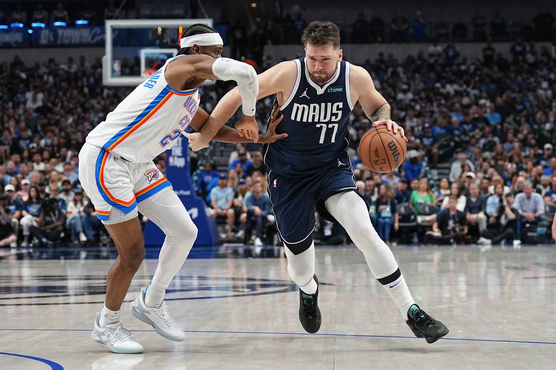 DALLAS, TX - MAY 11:  Luka Doncic #77 of the Dallas Mavericks goes to the basket during the game against Shai Gilgeous-Alexander #2 of the Oklahoma City Thunder during Round 2 Game 3 of the 2024 NBA Playoffs  on May 11, 2024  at the American Airlines Center in Dallas, Texas. NOTE TO USER: User expressly acknowledges and agrees that, by downloading and or using this photograph, User is consenting to the terms and conditions of the Getty Images License Agreement. Mandatory Copyright Notice: Copyright 2024 NBAE (Photo by Glenn James/NBAE via Getty Images)