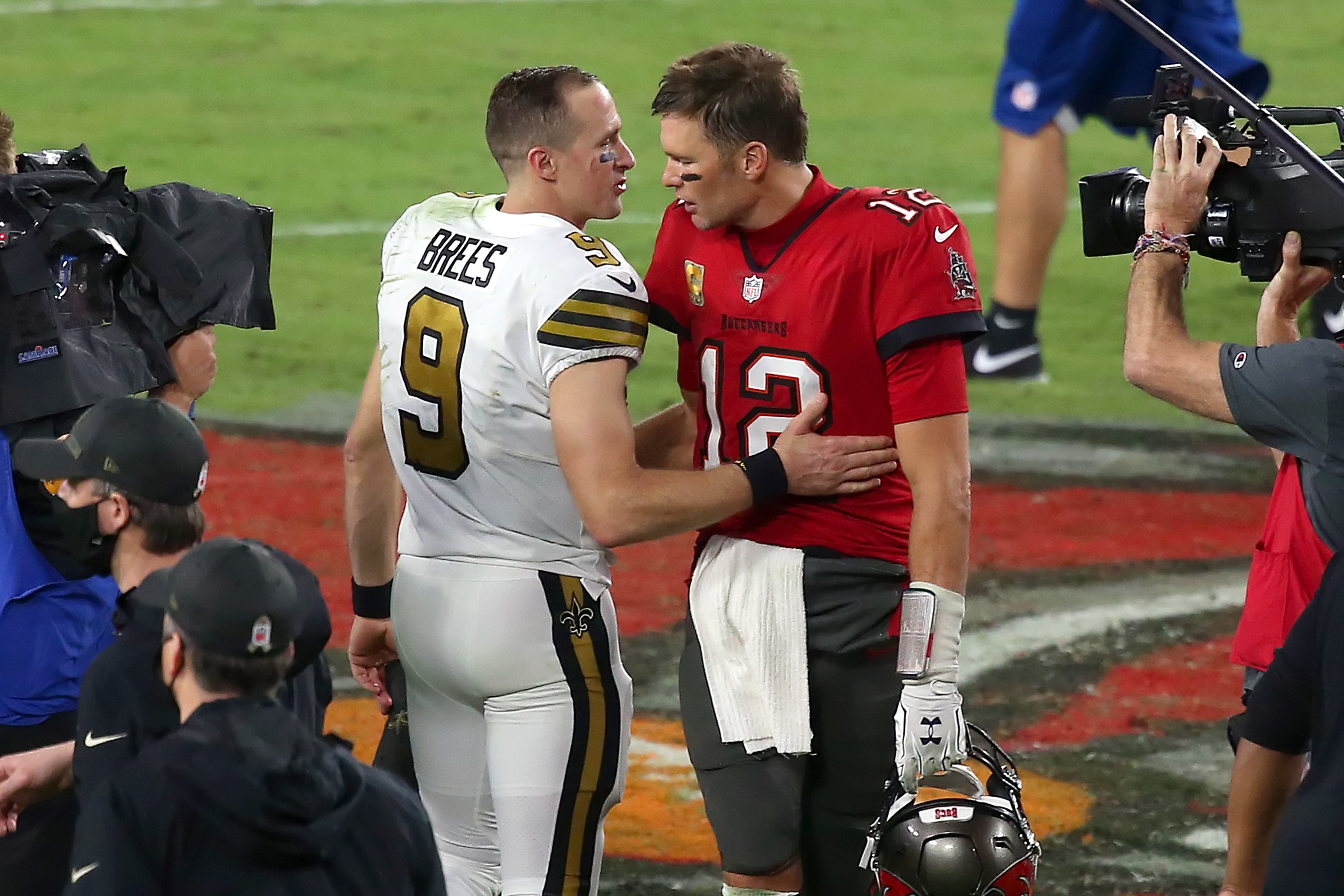 TAMPA, FL - NOVEMBER 08: Two of the greatest quarterbacks in NFL history Drew Brees (9) of the Saints and Tom Brady (12) of the Buccaneers share a few words of encouragement after the regular season game between the New Orleans Saints and the Tampa Bay Buccaneers on November 08, 2020 at Raymond James Stadium in Tampa, Florida. (Photo by Cliff Welch/Icon Sportswire via Getty Images)