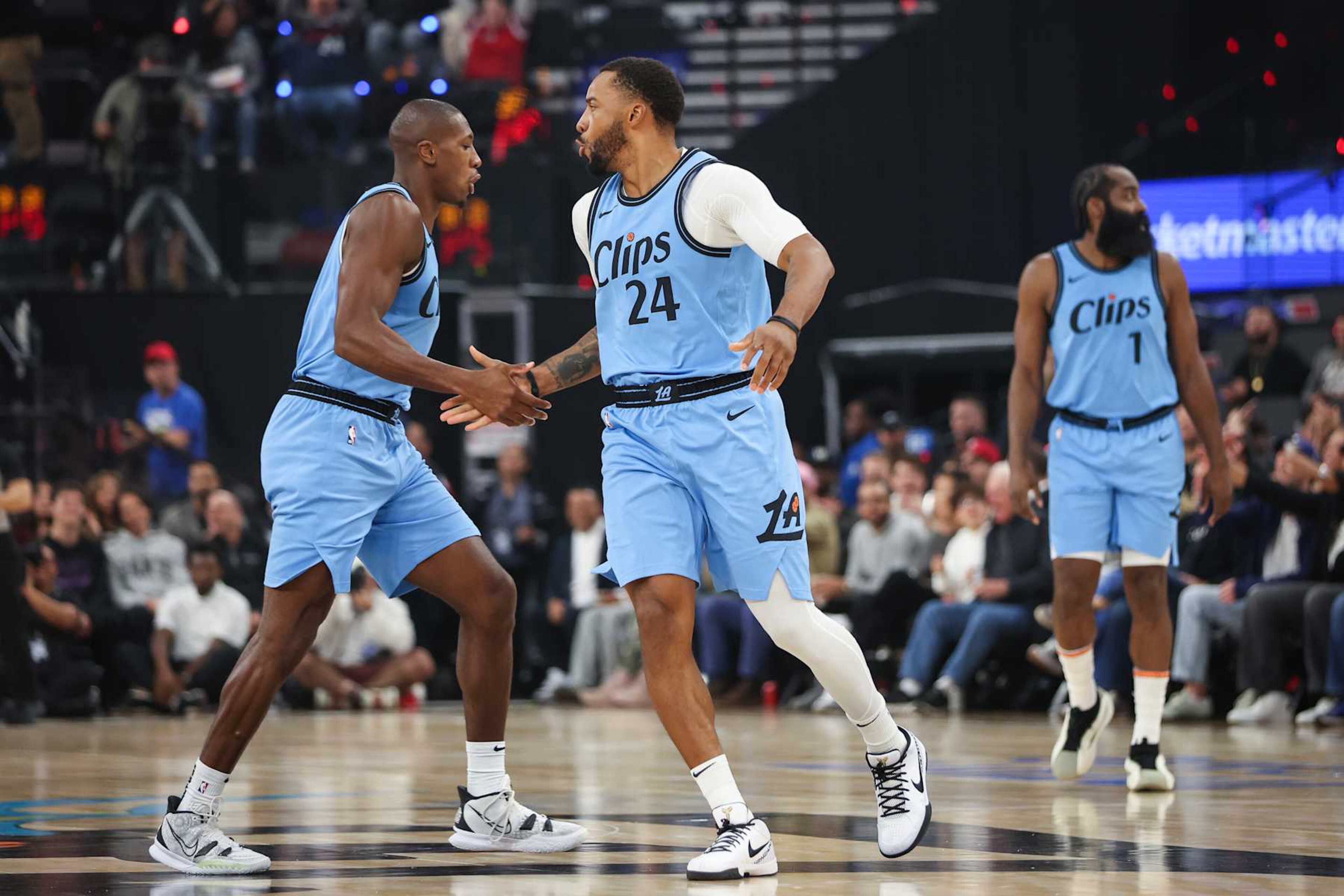 INGLEWOOD, CALIFORNIA - NOVEMBER 17: Kris Dunn #8 and Norman Powell #24 of the LA Clippers react in the first half against the Utah Jazz at Intuit Dome on November 17, 2024 in Inglewood, California. NOTE TO USER: User expressly acknowledges and agrees that, by downloading and/or using this photograph, user is consenting to the terms and conditions of the Getty Images License Agreement. (Photo by Meg Oliphant/Getty Images)