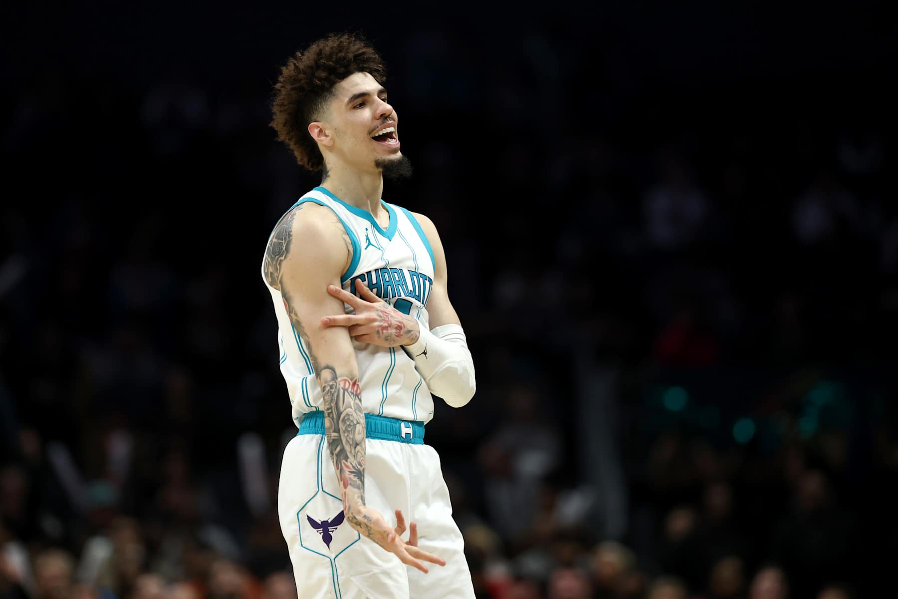 CHARLOTTE, NORTH CAROLINA - JANUARY 07: LaMelo Ball #1 of the Charlotte Hornets reacts following a three point basket during the second half of the game against the Phoenix Suns at Spectrum Center on January 07, 2025 in Charlotte, North Carolina. NOTE TO USER: User expressly acknowledges and agrees that, by downloading and or using this photograph, User is consenting to the terms and conditions of the Getty Images License Agreement. (Photo by Jared C. Tilton/Getty Images)