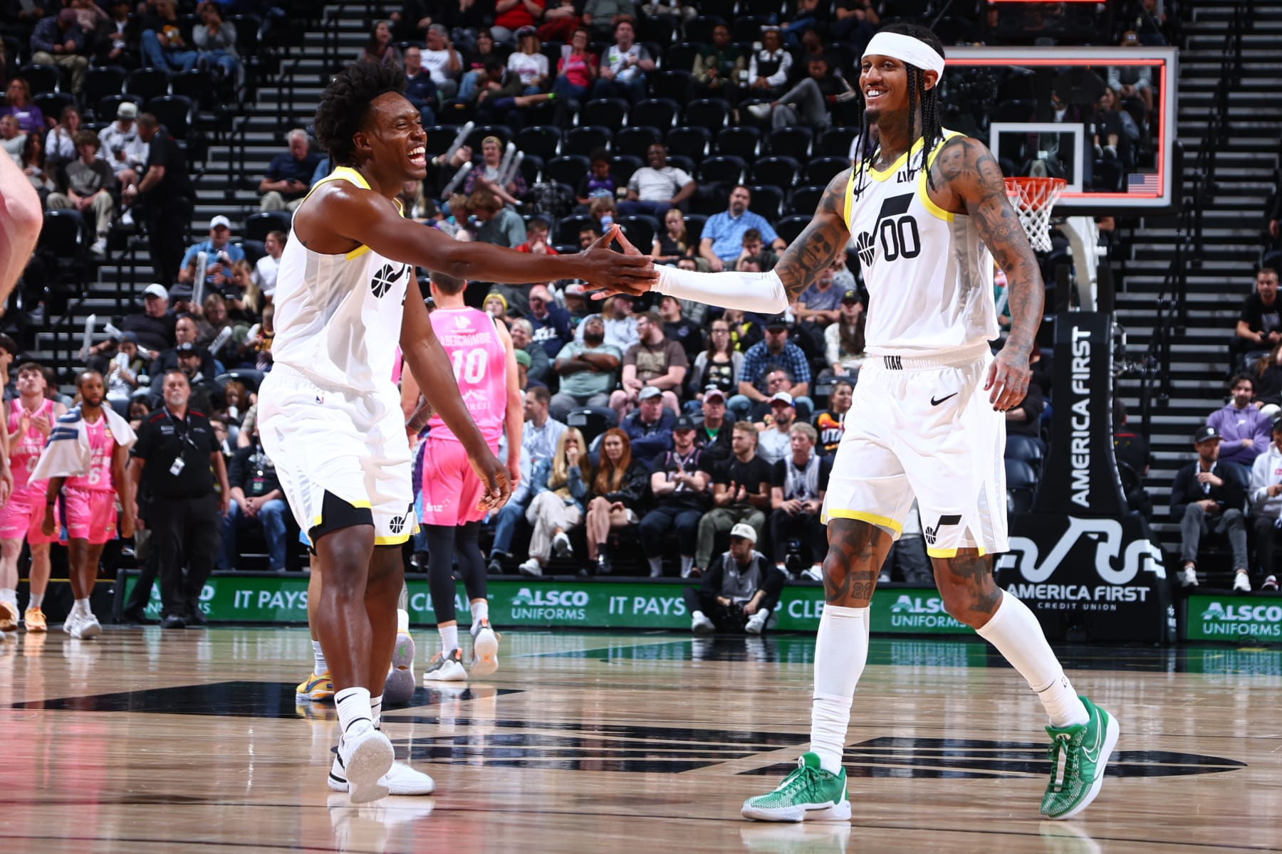 SALT LAKE CITY, UT - OCTOBER 16: Colin Sexton #2 high fives Jordan Clarkson #00 of the Utah Jazz during the preseason game on October 16, 2023 at vivint.SmartHome Arena in Salt Lake City, Utah. NOTE TO USER: User expressly acknowledges and agrees that, by downloading and or using this Photograph, User is consenting to the terms and conditions of the Getty Images License Agreement. Mandatory Copyright Notice: Copyright 2023 NBAE (Photo by Melissa Majchrzak/NBAE via Getty Images)