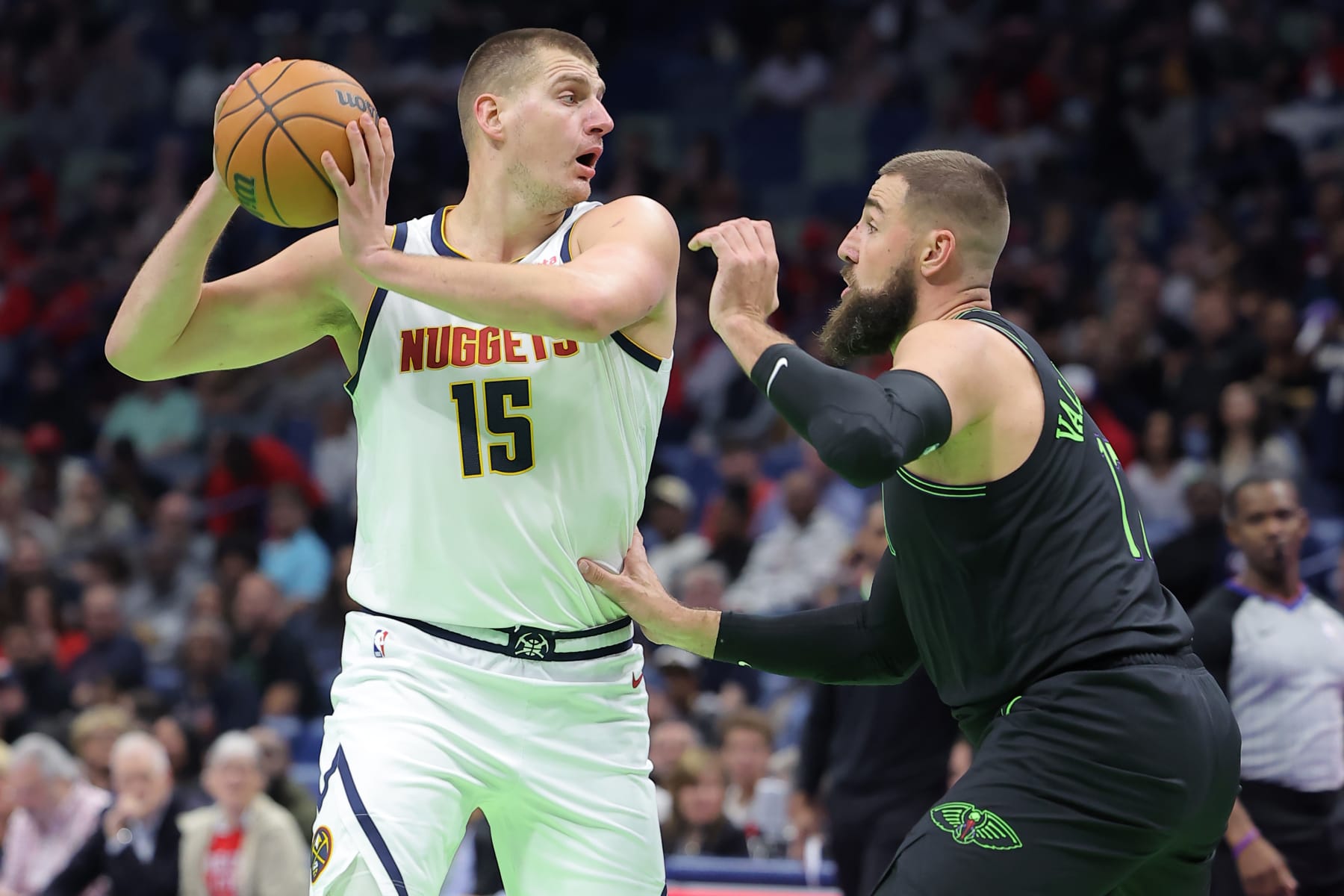 NEW ORLEANS, LOUISIANA - NOVEMBER 17: Nikola Jokic #15 of the Denver Nuggets drives against Jonas Valanciunas #17 of the New Orleans Pelicans during the first half of an NBA In-Season Tournament game at the Smoothie King Center on November 17, 2023 in New Orleans, Louisiana. NOTE TO USER: User expressly acknowledges and agrees that, by downloading and or using this Photograph, user is consenting to the terms and conditions of the Getty Images License Agreement. (Photo by Jonathan Bachman/Getty Images)