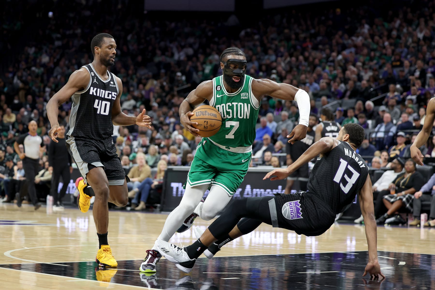 SACRAMENTO, CALIFORNIA - MARCH 21: Jaylen Brown #7 of the Boston Celtics is guarded by Keegan Murray #13 of the Sacramento Kings at Golden 1 Center on March 21, 2023 in Sacramento, California. NOTE TO USER: User expressly acknowledges and agrees that, by downloading and or using this photograph, User is consenting to the terms and conditions of the Getty Images License Agreement.  (Photo by Ezra Shaw/Getty Images)