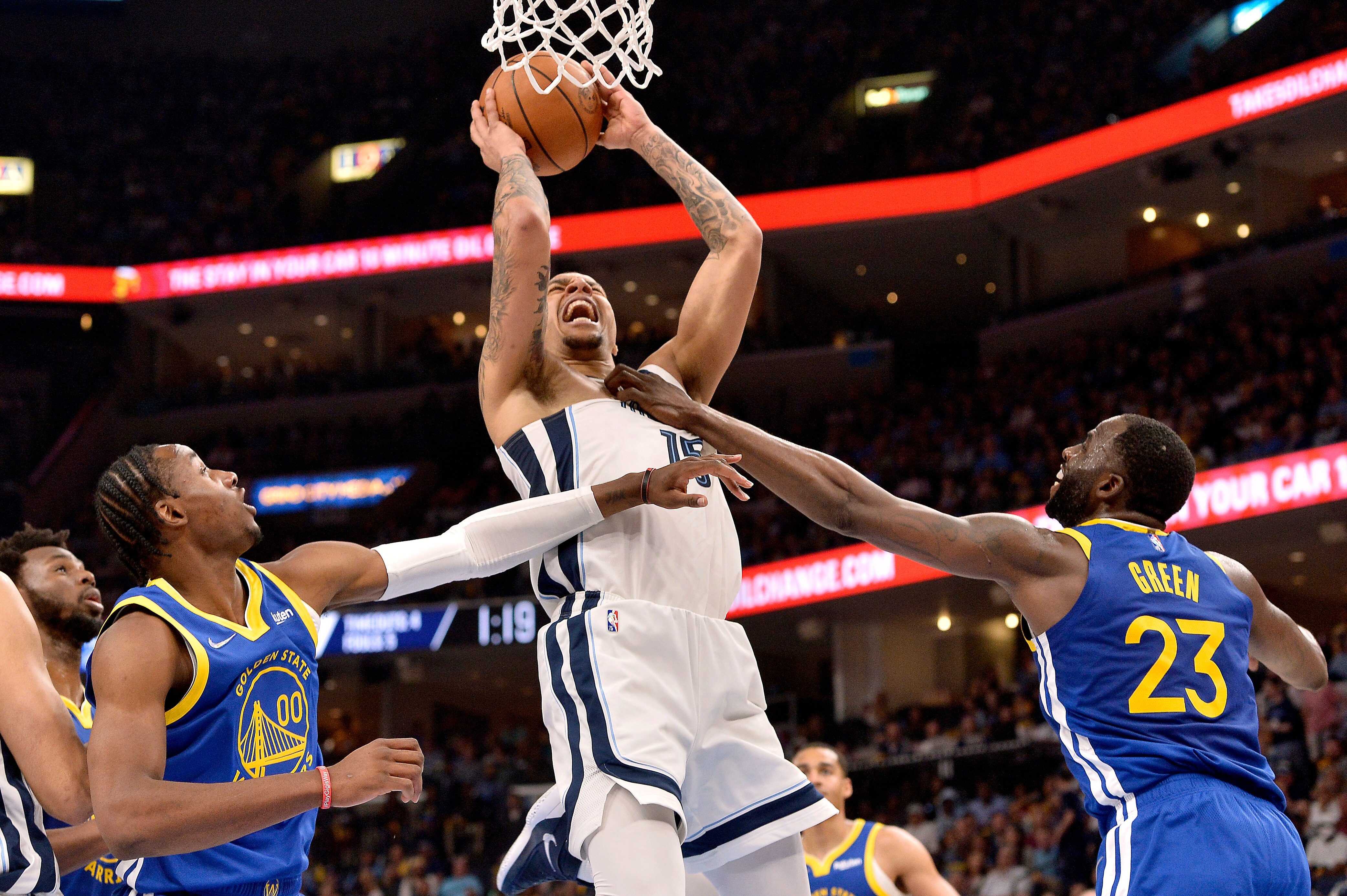 Golden State Warriors forward Draymond Green (23) fouls Memphis Grizzlies forward Brandon Clarke (15), resulting in Green being ejected, in the first half during Game 1 of a second-round NBA basketball playoff series Sunday, May 1, 2022, in Memphis, Tenn. (AP Photo/Brandon Dill)