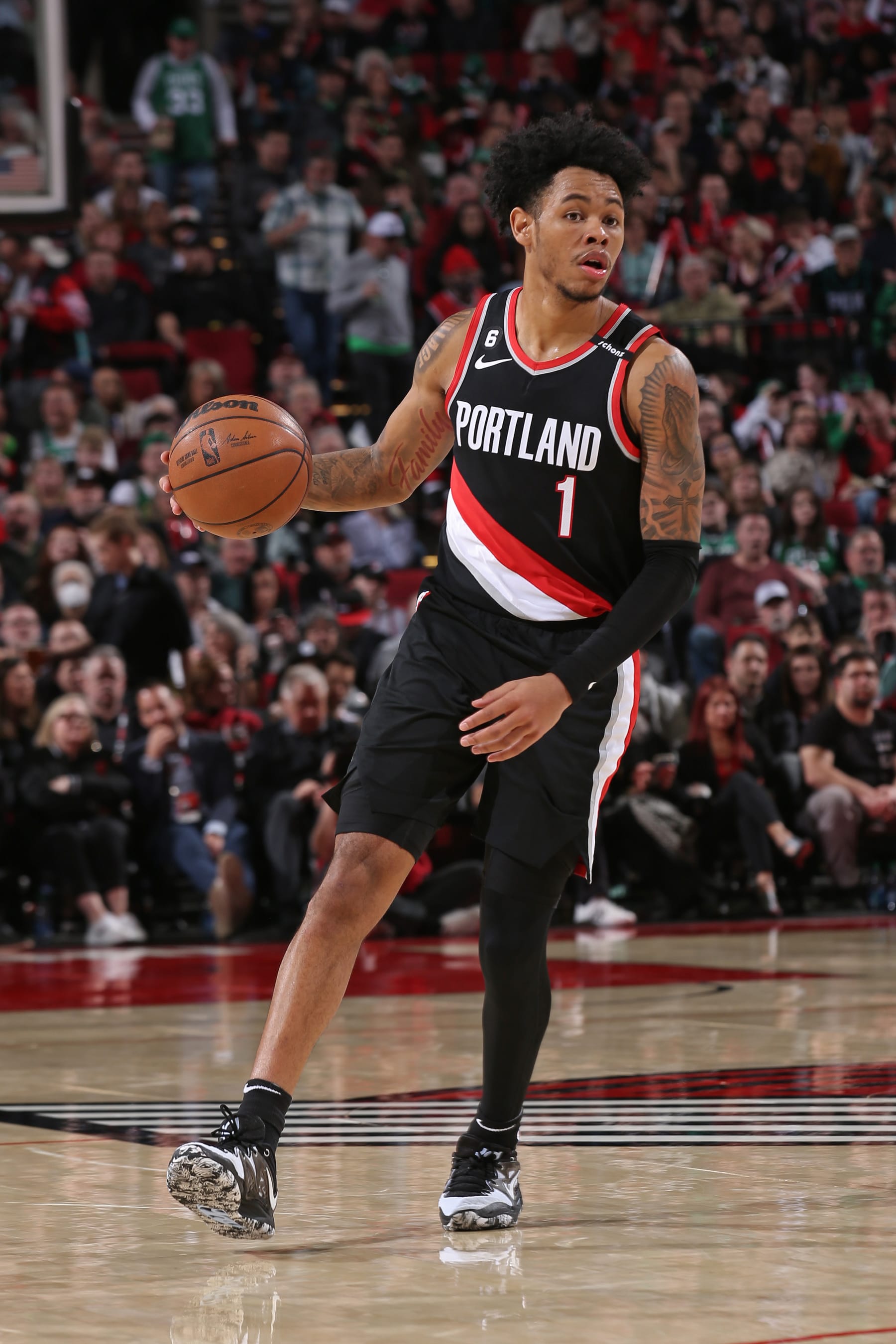 PORTLAND, OR - MARCH 17: Anfernee Simons #1 of the Portland Trail Blazers dribbles the ball during the game against the Boston Celtics on March 17, 2023 at the Moda Center Arena in Portland, Oregon. NOTE TO USER: User expressly acknowledges and agrees that, by downloading and or using this photograph, user is consenting to the terms and conditions of the Getty Images License Agreement. Mandatory Copyright Notice: Copyright 2023 NBAE (Photo by Cameron Browne/NBAE via Getty Images)