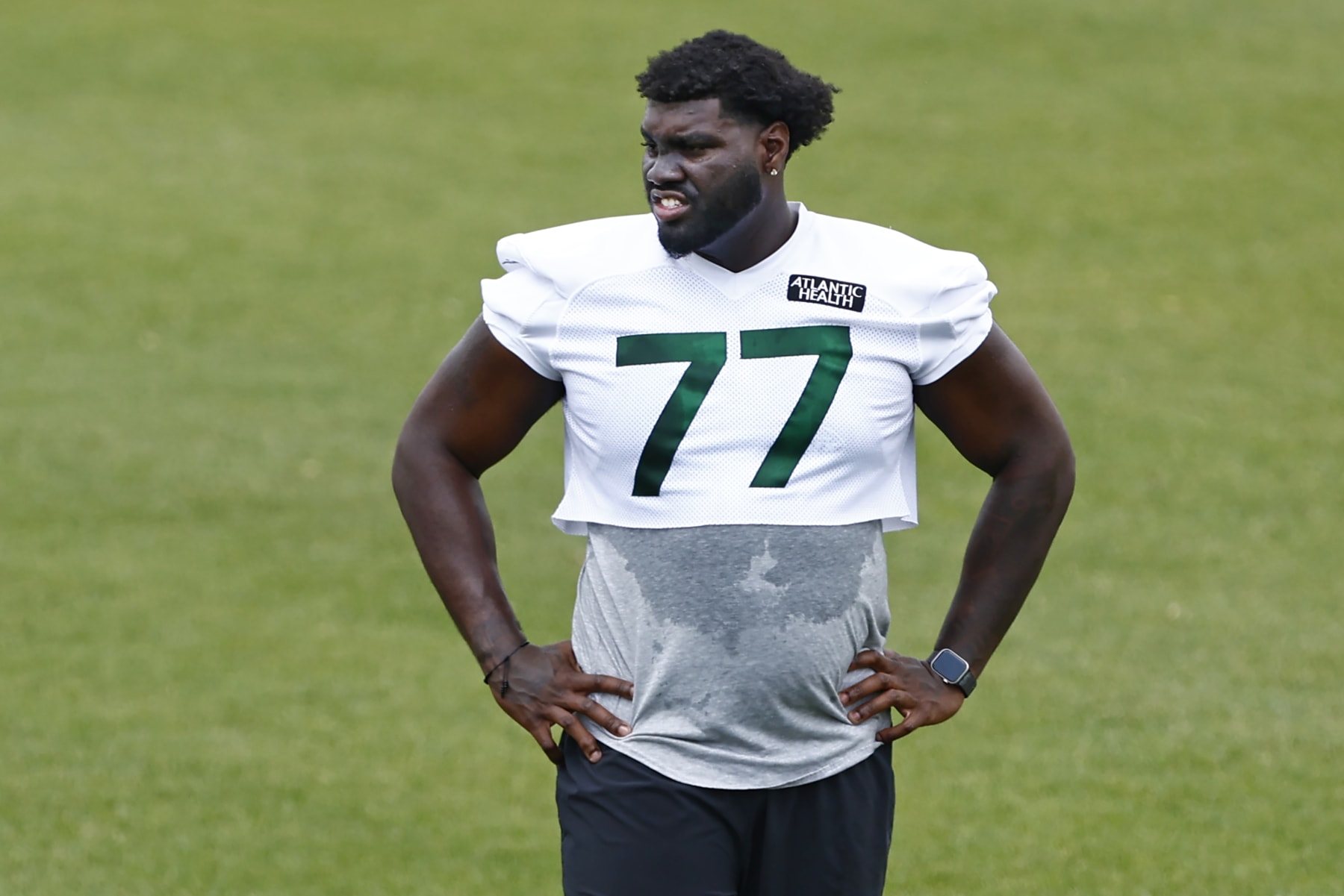 FLORHAM PARK, NEW JERSEY - JUNE 9: Tackle Mekhi Becton #77 of the New York Jets works out on a side field during the teams OTAs at Atlantic Health Jets Training Center on June 9, 2023 in Florham Park, New Jersey. (Photo by Rich Schultz/Getty Images)