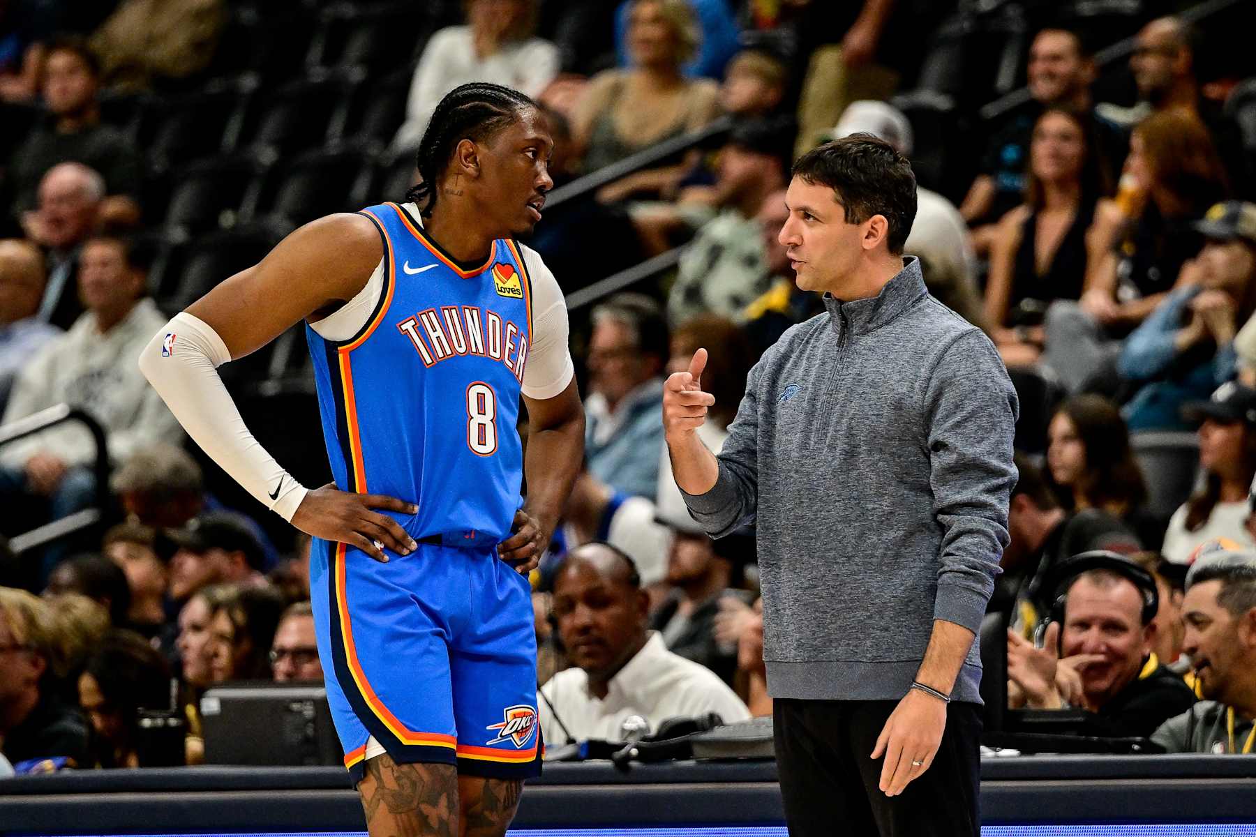 DENVER, COLORADO - OCTOBER 25: Head Coach Mark Daigneault of the Oklahoma City Thunder has a word with Jalen Williams #8 in the first half of the game between the Oklahoma City Thunder and the Denver Nuggets at Ball Arena on October 15, 2024 in Denver, Colorado. NOTE TO USER: User expressly acknowledges and agrees that, by downloading and or using this photograph, User is consenting to the terms and conditions of the Getty Images License Agreement. (Photo by Dustin Bradford/Getty Images)