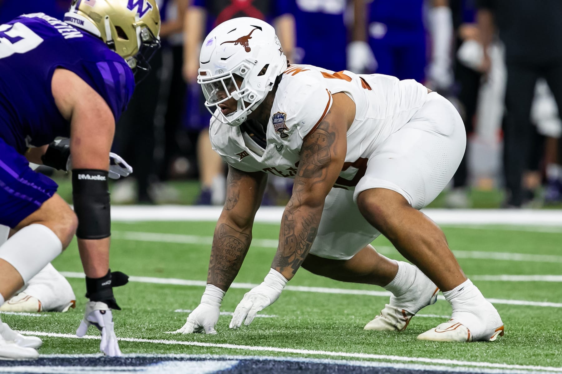 NEW ORLEANS, LA - JANUARY 01: Texas defensive lineman Byron Murphy II (90) gets set at the line of scrimmage during the Allstate Sugar Bowl playoff game between the Texas Longhorns and the Washington Huskies on Monday, January 1, 2024 at Caesars Superdome in New Orleans, LA.  (Photo by Nick Tre. Smith/Icon Sportswire via Getty Images)