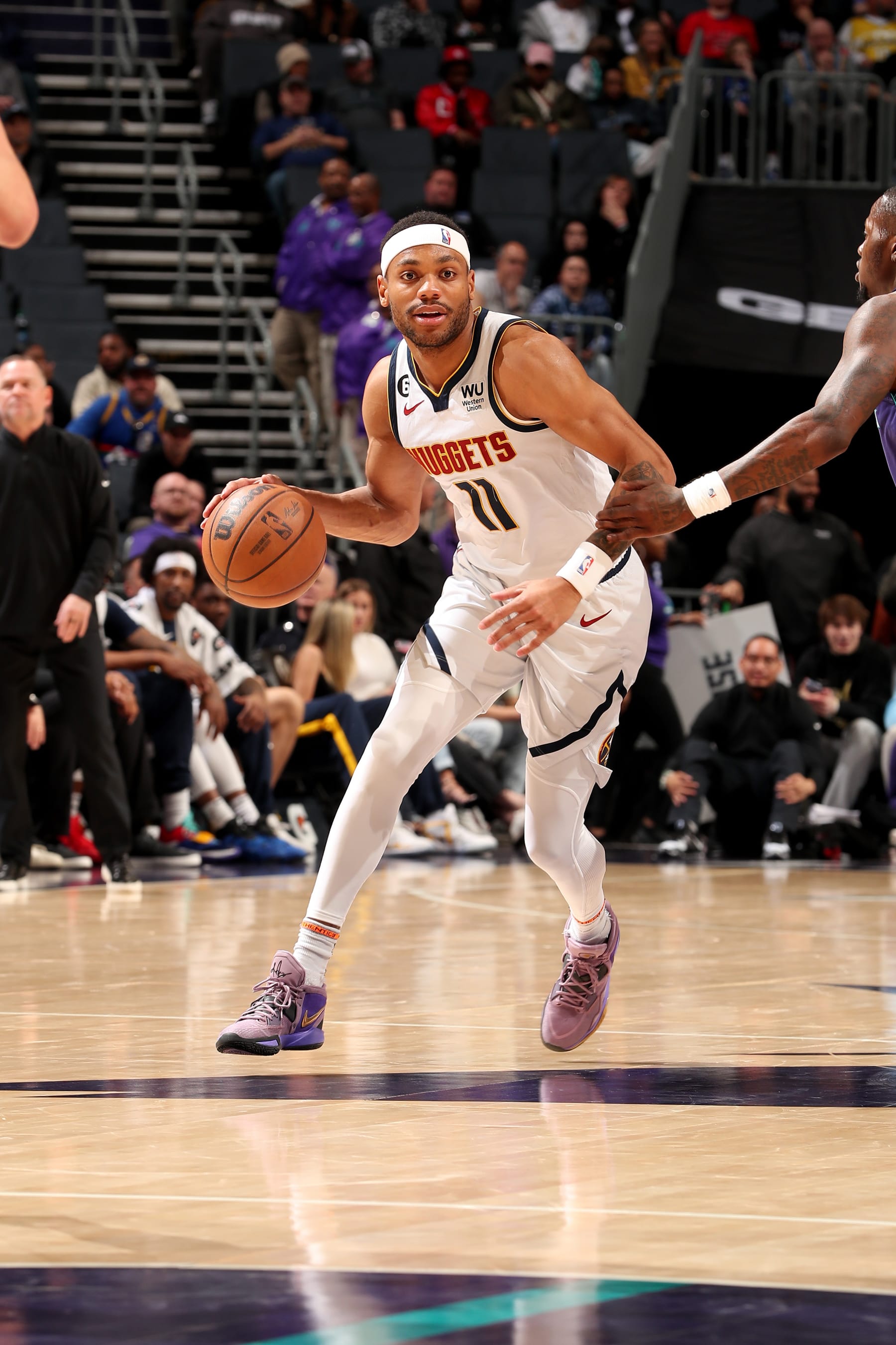 CHARLOTTE, NC - FEBRUARY 11: Bruce Brown #11 of the Denver Nuggets looks to pass the ball during the game against the Charlotte Hornets on February 11, 2023 at Spectrum Center in Charlotte, North Carolina. NOTE TO USER: User expressly acknowledges and agrees that, by downloading and or using this photograph, User is consenting to the terms and conditions of the Getty Images License Agreement. Mandatory Copyright Notice: Copyright 2023 NBAE (Photo by Kent Smith/NBAE via Getty Images)