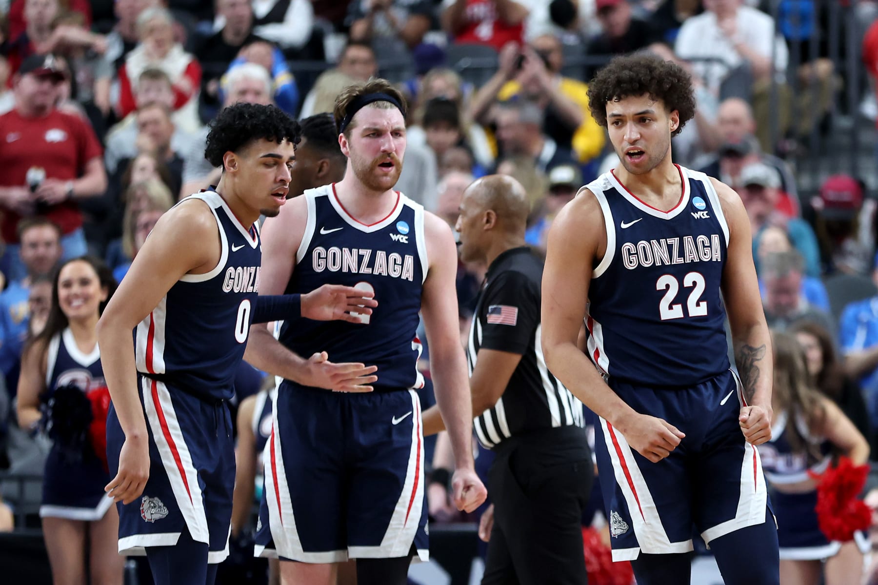 LAS VEGAS, NEVADA - MARCH 23: Anton Watson #22 of the Gonzaga Bulldogs reacts after drawing a foul with teammates Julian Strawther #0 and Drew Timme #2 during the second half against the UCLA Bruins in the Sweet 16 round of the NCAA Men's Basketball Tournament at T-Mobile Arena on March 23, 2023 in Las Vegas, Nevada. (Photo by Sean M. Haffey/Getty Images)
