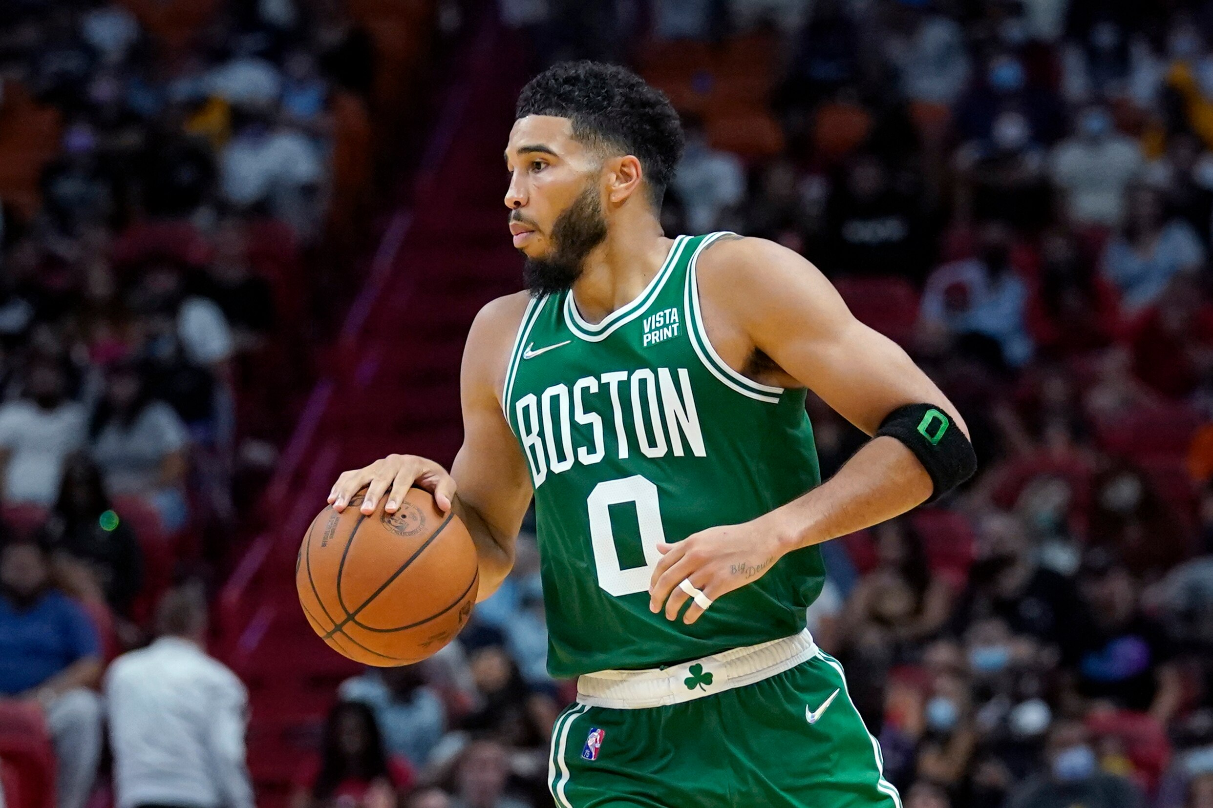 Boston Celtics forward Jayson Tatum (0) is in action during the second half of a preseason NBA basketball game against the Miami Heat, Friday, Oct. 15, 2021, in Miami. The Heat won 121-100. (AP Photo/Lynne Sladky)