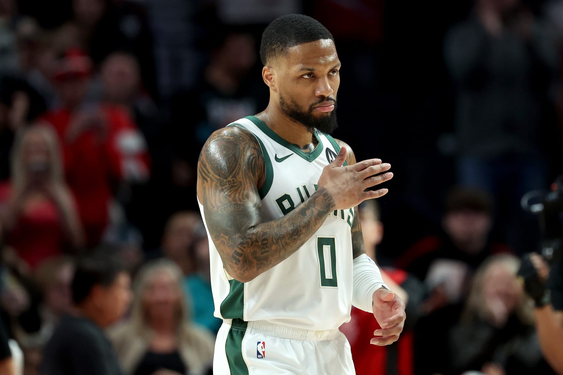 PORTLAND, OREGON - JANUARY 31: Damian Lillard #0 of the Milwaukee Bucks reacts during the first quarter against the Portland Trail Blazers at Moda Center on January 31, 2024 in Portland, Oregon. (Photo by Steph Chambers/Getty Images)