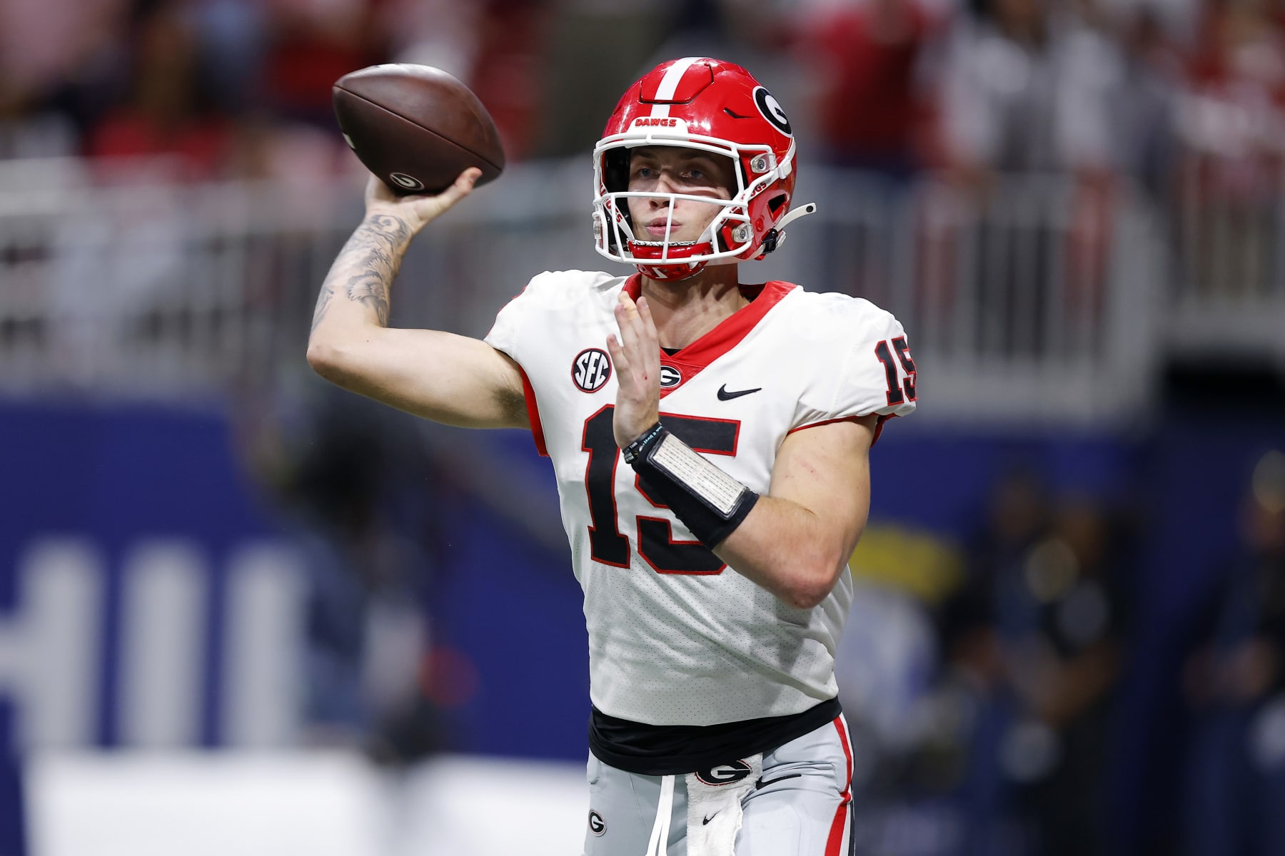 ATLANTA, GEORGIA - DECEMBER 02: Carson Beck #15 of the Georgia Bulldogs passes the ball during the third quarter against the Alabama Crimson Tide in the SEC Championship at Mercedes-Benz Stadium on December 02, 2023 in Atlanta, Georgia. (Photo by Todd Kirkland/Getty Images)