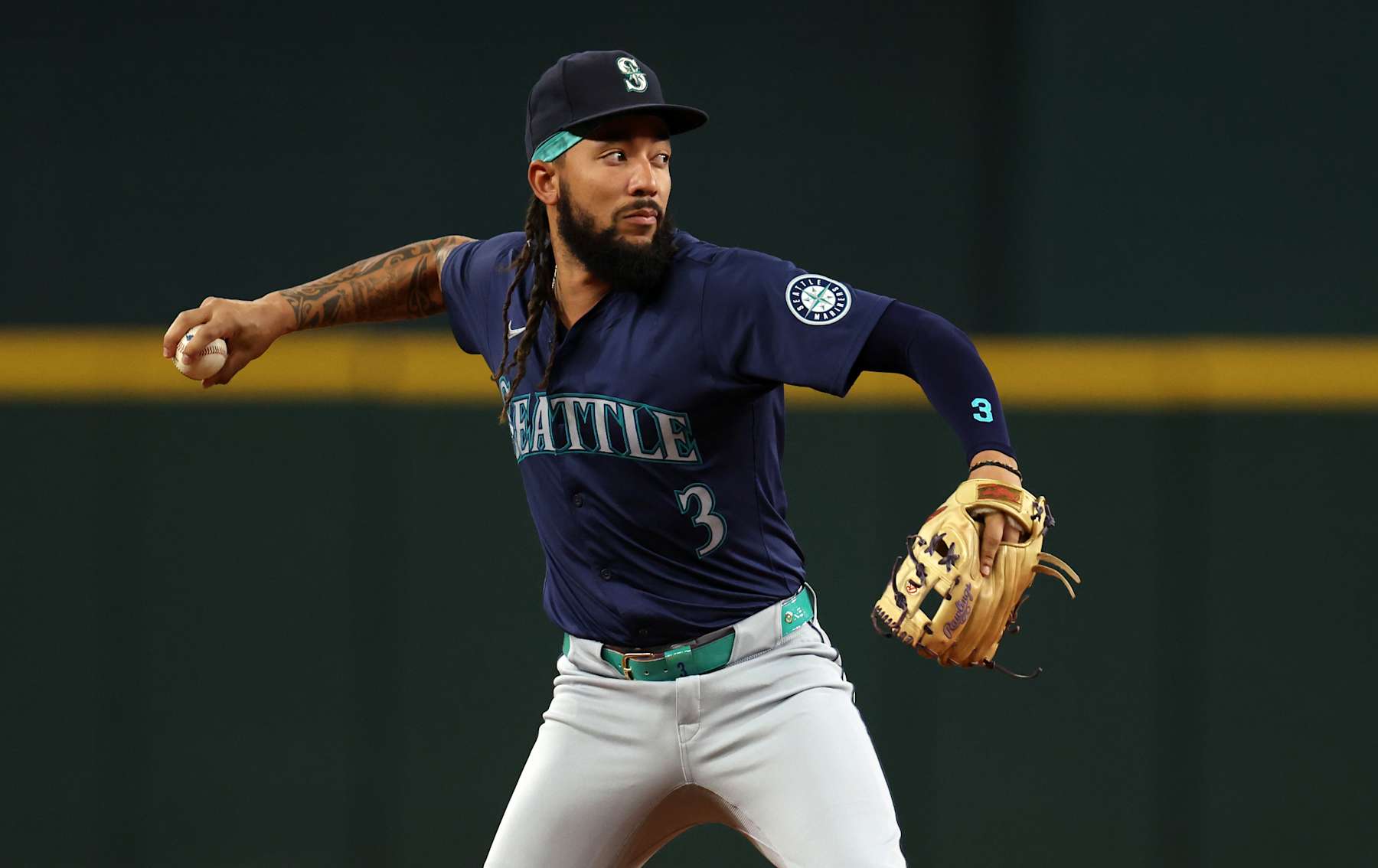 ARLINGTON, TX - SEPTEMBER 20: J.P. Crawford #3 of the Seattle Mariners throws to first base against the Texas Rangers at Globe Life Field on September 20, 2024 in Arlington, Texas. (Photo by Ron Jenkins/Getty Images)