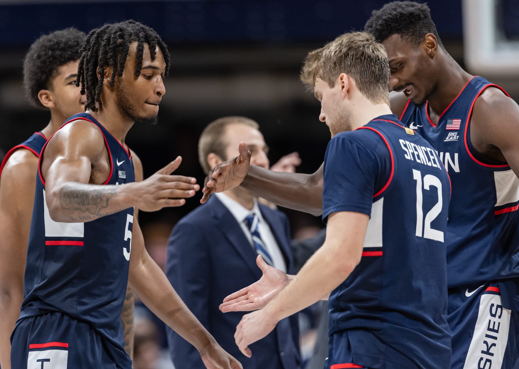 INDIANAPOLIS, INDIANA - JANUARY 5: Stephon Castle #5 celebrates with Cam Spencer #12 of the Connecticut Huskies during the game against the Butler Bulldogs at Hinkle Fieldhouse on January 5, 2024 in Indianapolis, Indiana. (Photo by Michael Hickey/Getty Images)