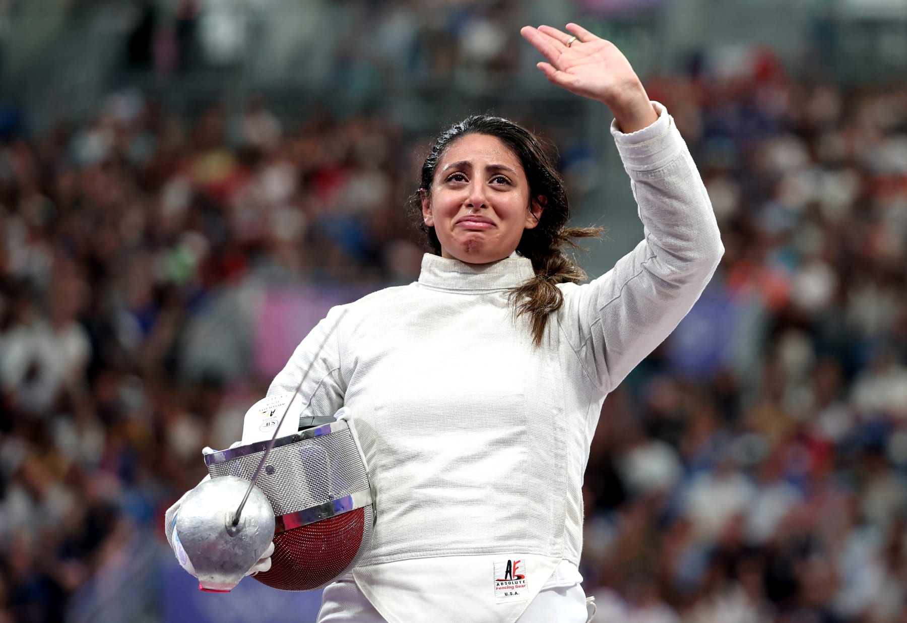 PARIS, FRANCE - JULY 29: Nada Hafez of Team Egypt applauds fans after her victory against Elizabeth Tartakovsky of Team United States (not pictured) in the Fencing Women's Sabre Individual Table of 32 on day three of the Olympic Games Paris 2024 at Grand Palais on July 29, 2024 in Paris, France. (Photo by Al Bello/Getty Images)