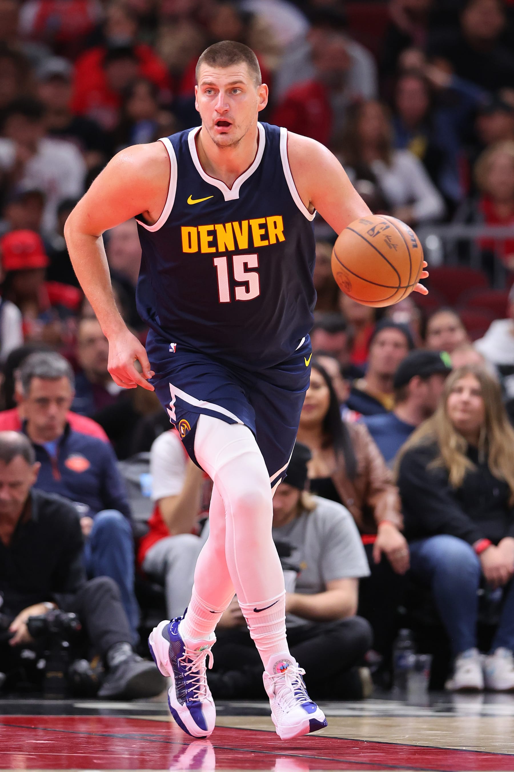 CHICAGO, ILLINOIS - OCTOBER 12: Nikola Jokic #15 of the Denver Nuggets dribbles up the court against the Chicago Bulls during the first half at the United Center on October 12, 2023 in Chicago, Illinois. NOTE TO USER: User expressly acknowledges and agrees that, by downloading and or using this photograph, User is consenting to the terms and conditions of the Getty Images License Agreement.  (Photo by Michael Reaves/Getty Images)