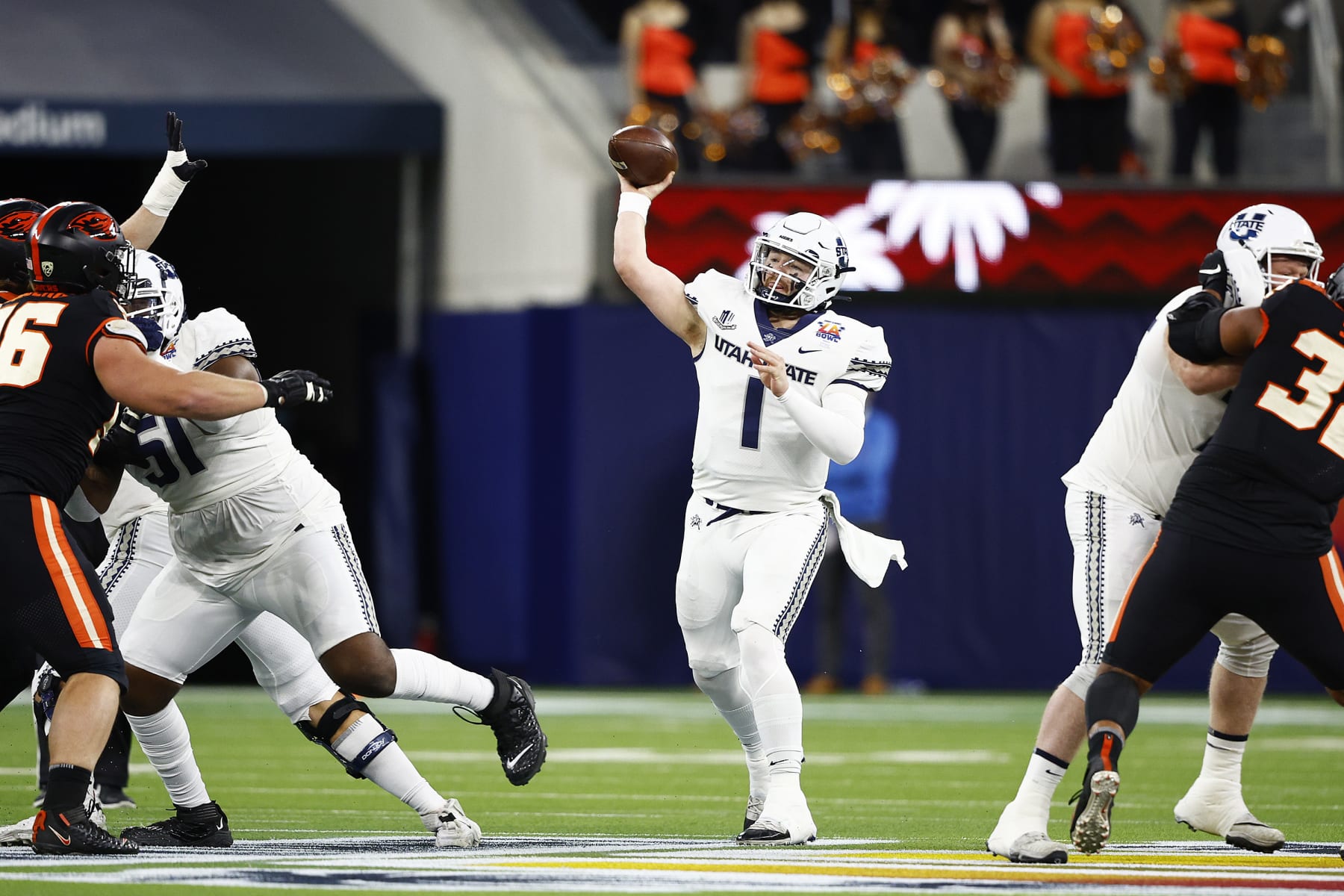 INGLEWOOD, CALIFORNIA - DECEMBER 18: Logan Bonner #1 of the Utah State Aggies throws the ball in the first quarter of the game against the Oregon State Beavers in the Jimmy Kimmel LA BOWL Presented by Stifel at SoFi Stadium on December 18, 2021 in Inglewood, California. (Photo by Ronald Martinez/Getty Images)