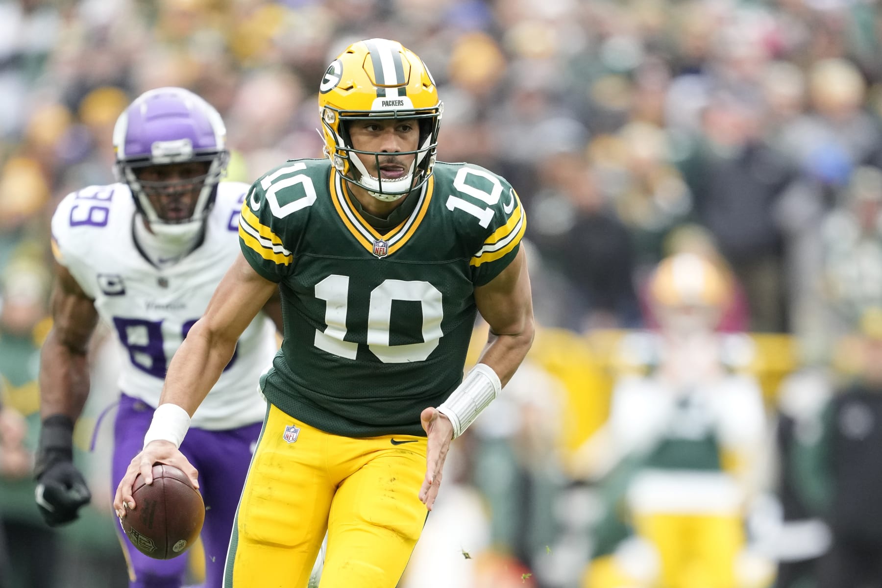 GREEN BAY, WISCONSIN - OCTOBER 29: Jordan Love #10 of the Green Bay Packers runs with the ball in the second half against the Minnesota Vikings at Lambeau Field on October 29, 2023 in Green Bay, Wisconsin. (Photo by Patrick McDermott/Getty Images)