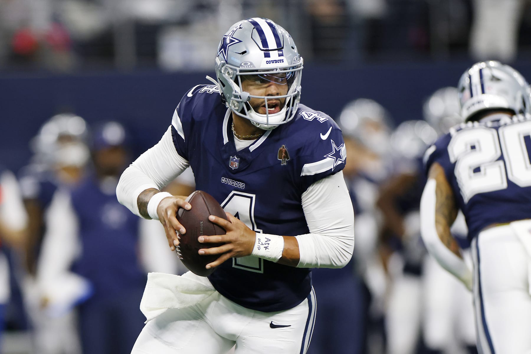ARLINGTON, TEXAS - OCTOBER 29: Dak Prescott #4 of the Dallas Cowboys looks to pass during the first quarter of a game against the Los Angeles Rams at AT&T Stadium on October 29, 2023 in Arlington, Texas. (Photo by Ron Jenkins/Getty Images)