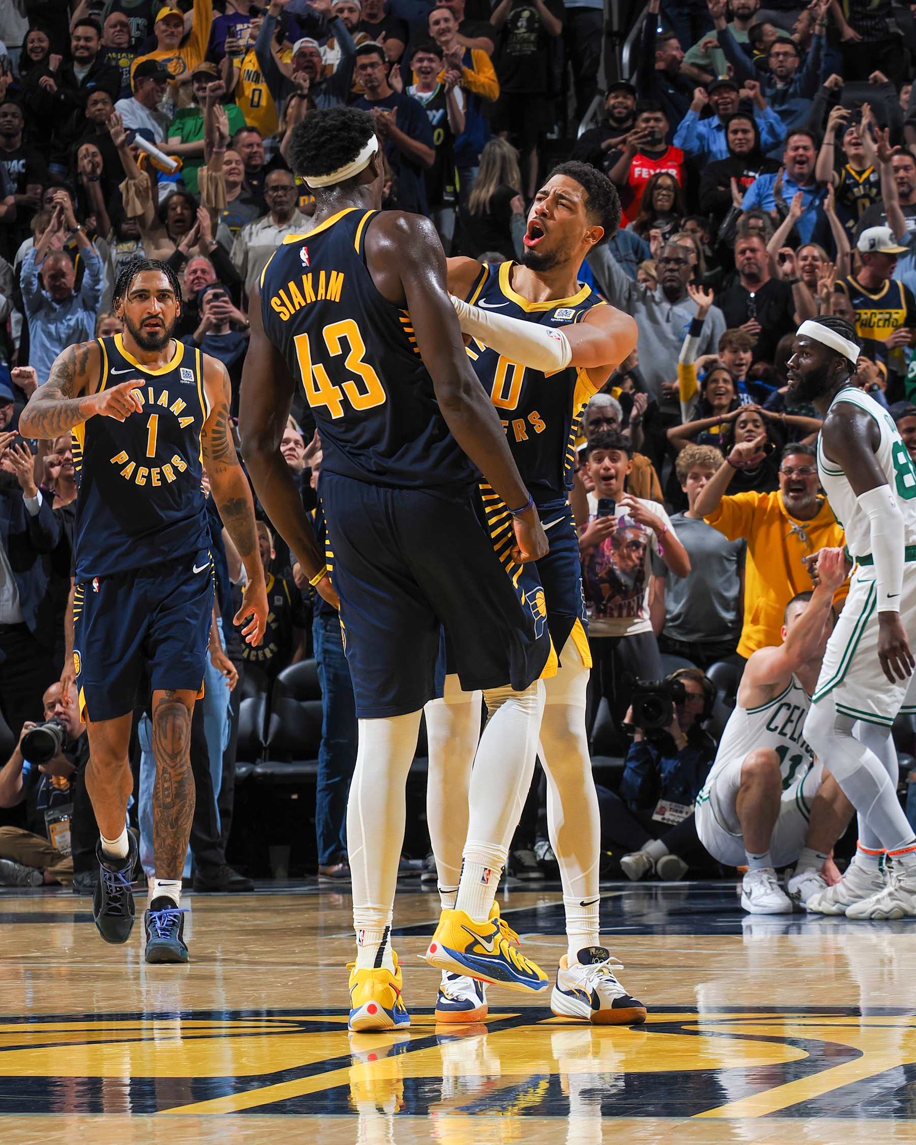INDIANAPOLIS, IN - OCTOBER 30: Tyrese Haliburton #0 celebrates with teammate Pascal Siakam #43 of the Indiana Pacers after Siakam made a game-winning three-point field goal in overtime of the game against the Boston Celtics on October 30, 2024 at Gainbridge Fieldhouse in Indianapolis, Indiana. NOTE TO USER: User expressly acknowledges and agrees that, by downloading and or using this Photograph, user is consenting to the terms and conditions of the Getty Images License Agreement. Mandatory Copyright Notice: Copyright 2024 NBAE (Photo by Ron Hoskins/NBAE via Getty Images)