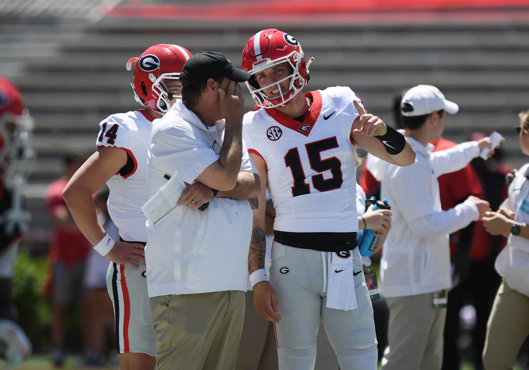 Athens, GA - APRIL 13: Georgia Bulldogs Offensive Coordinator Mike Bobo talks to Georgia Bulldogs Quarterback Carson Beck (15) prior to the G-Day Red and Black Spring Game on April 13, 2024, Sanford Stadium in Athens, GA. (Photo by Jeffrey Vest/Icon Sportswire via Getty Images)