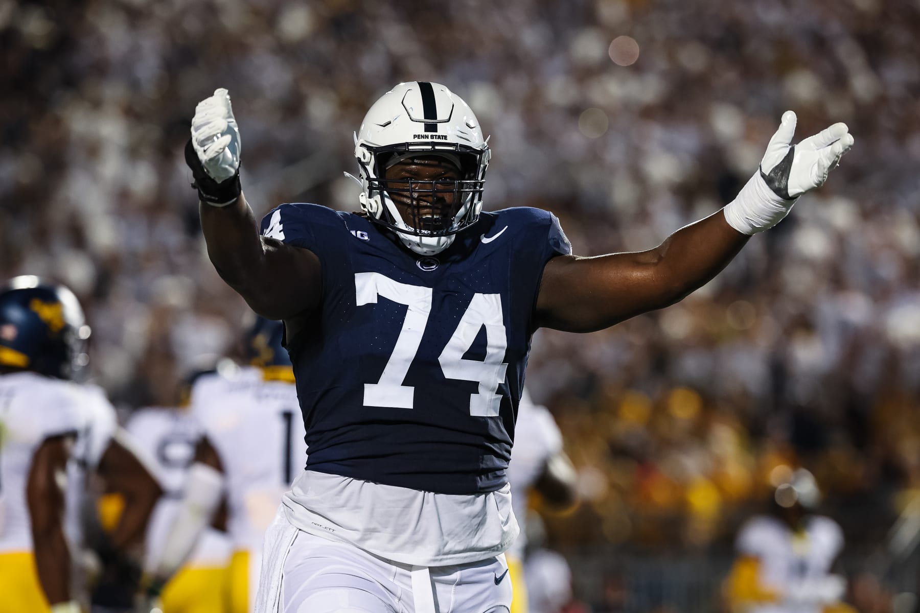 STATE COLLEGE, PA - SEPTEMBER 02: Olumuyiwa Fashanu #74 of the Penn State Nittany Lions celebrates after a play against the West Virginia Mountaineers during the first half of the game at Beaver Stadium on September 2, 2023 in State College, Pennsylvania. (Photo by Scott Taetsch/Getty Images)