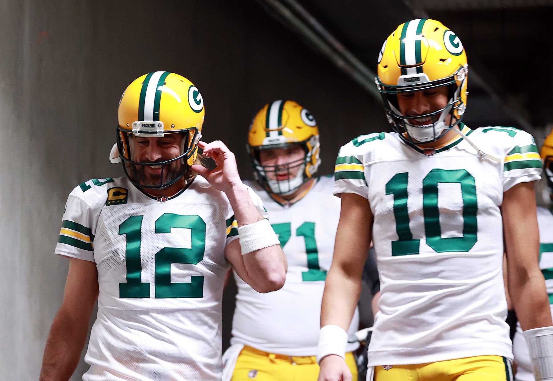 DETROIT, MICHIGAN - JANUARY 09: Aaron Rodgers #12 and Jordan Love #10 of the Green Bay Packers prepare to take the field prior to playing the Detroit Lions at Ford Field on January 09, 2022 in Detroit, Michigan. (Photo by Rey Del Rio/Getty Images)