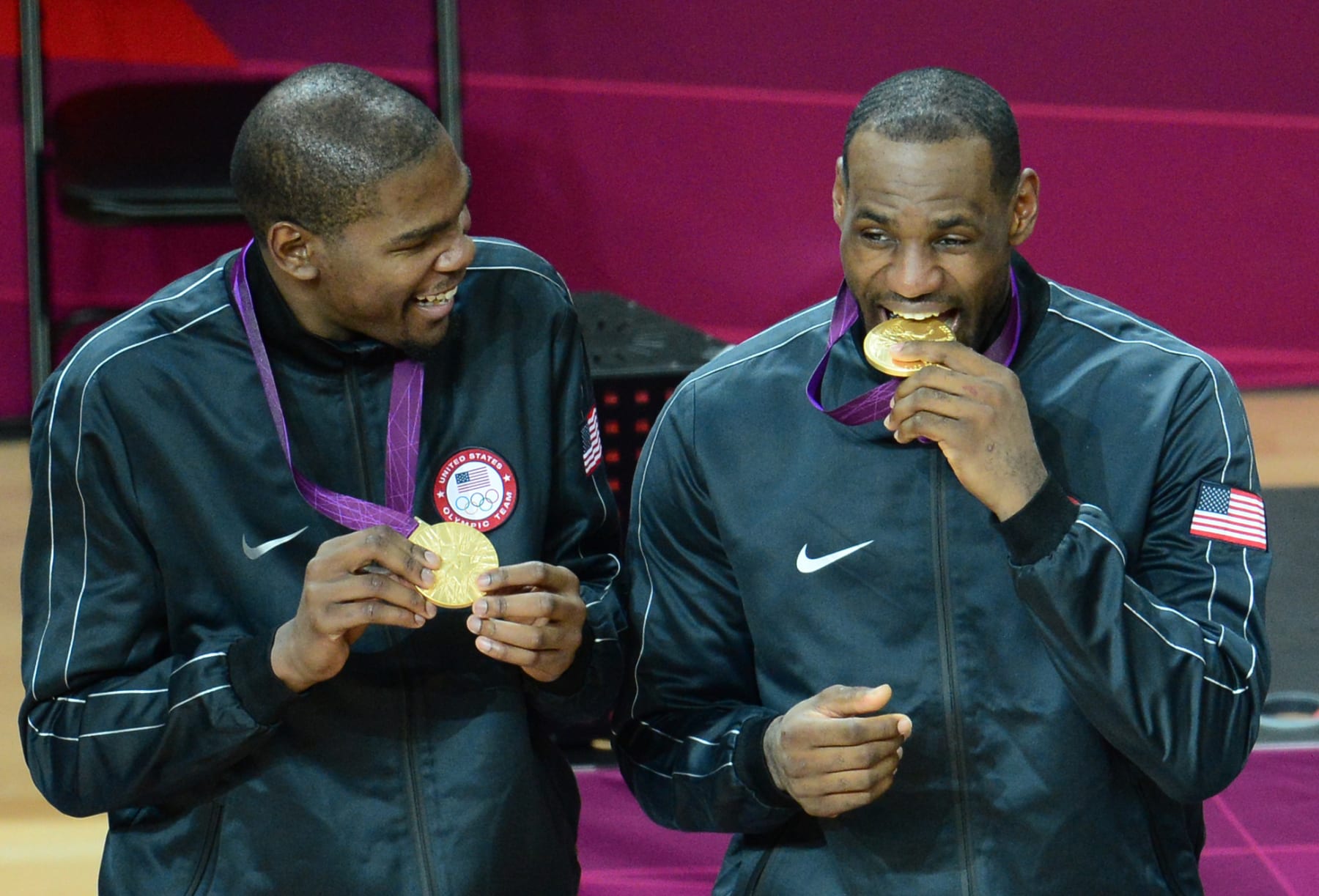 US forward Kevin Durant (L) and US forward LeBron James (R) pose with their gold medals after winning the London 2012 Olympic Games men's basketball competition at the North Greenwich Arena in London on August 12, 2012. The US won the gold medal followed by the silver to Spain and the bronze to Russia. AFP PHOTO /EMMANUEL DUNAND        (Photo credit should read EMMANUEL DUNAND/AFP/GettyImages)
