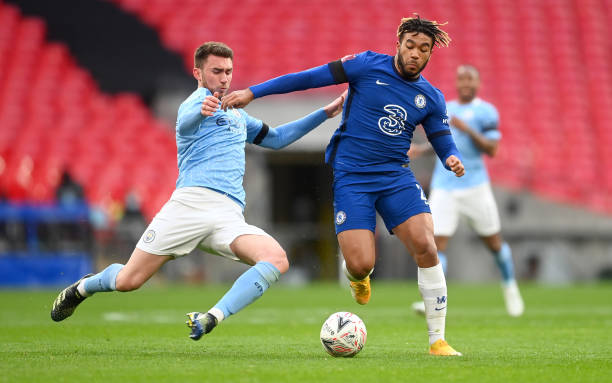 LONDON, ENGLAND - APRIL 17: Reece James of Chelsea is challenged by Aymeric Laporte of Manchester City during the Semi Final of the Emirates FA Cup match between Manchester City and Chelsea FC at Wembley Stadium on April 17, 2021 in London, England. Sporting stadiums around the UK remain under strict restrictions due to the Coronavirus Pandemic as Government social distancing laws prohibit fans inside venues resulting in games being played behind closed doors.  (Photo by Michael Regan - The FA/The FA via Getty Images)